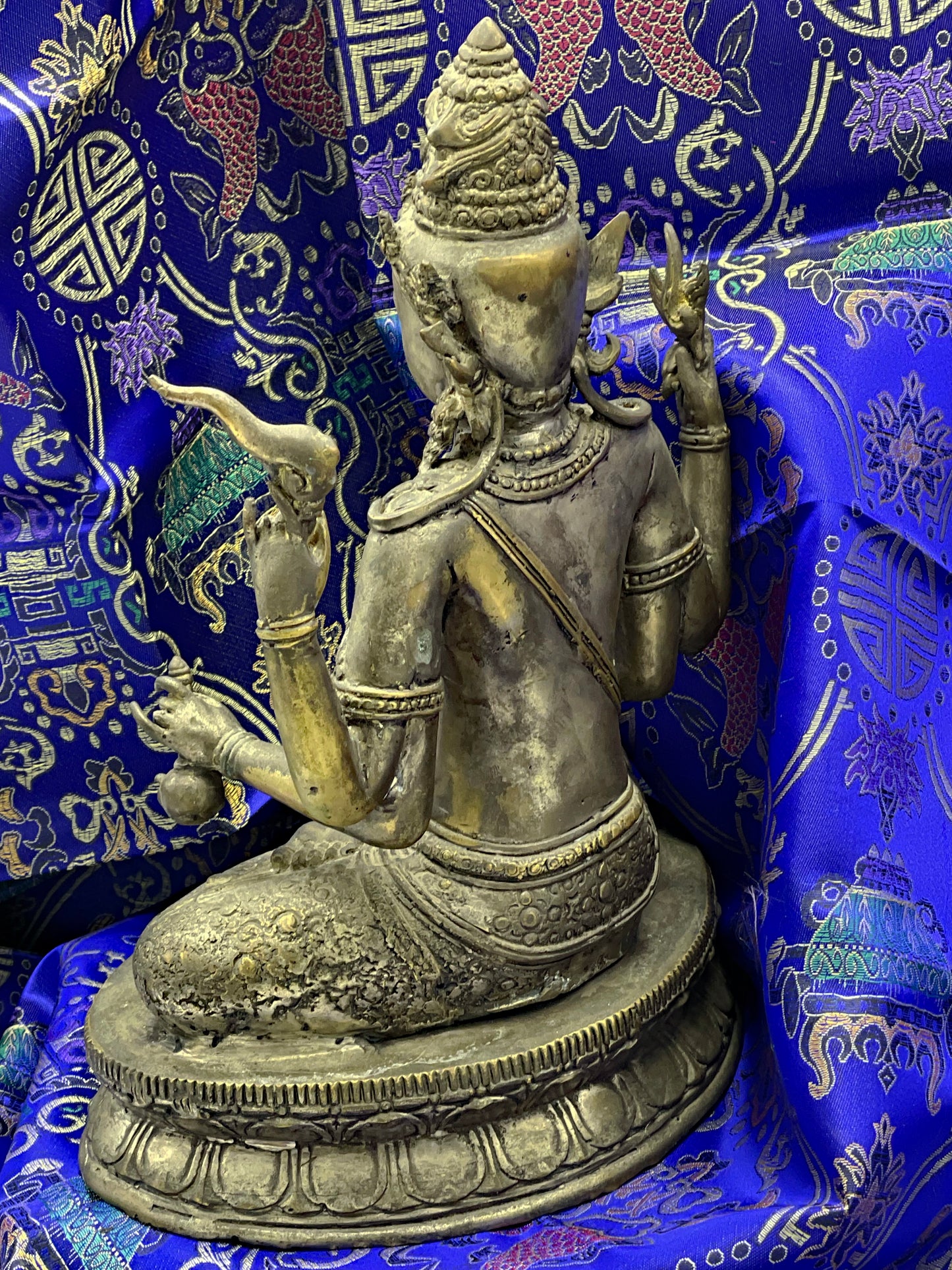 Rear three quarter view of bronze Vishnu with sacred thread and lotus base