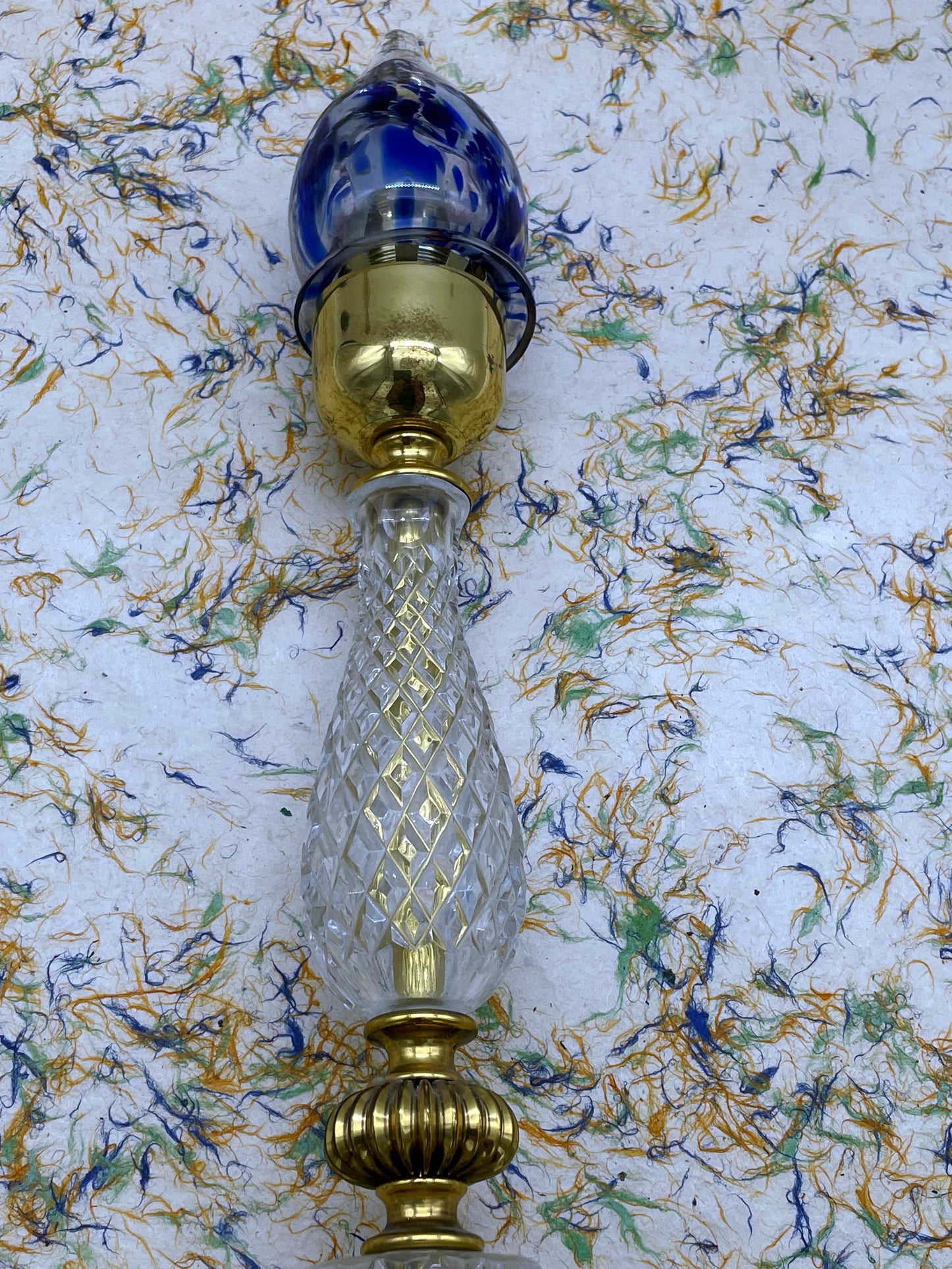 Detail of brass cup and crystal stem of the Murano glass lamp