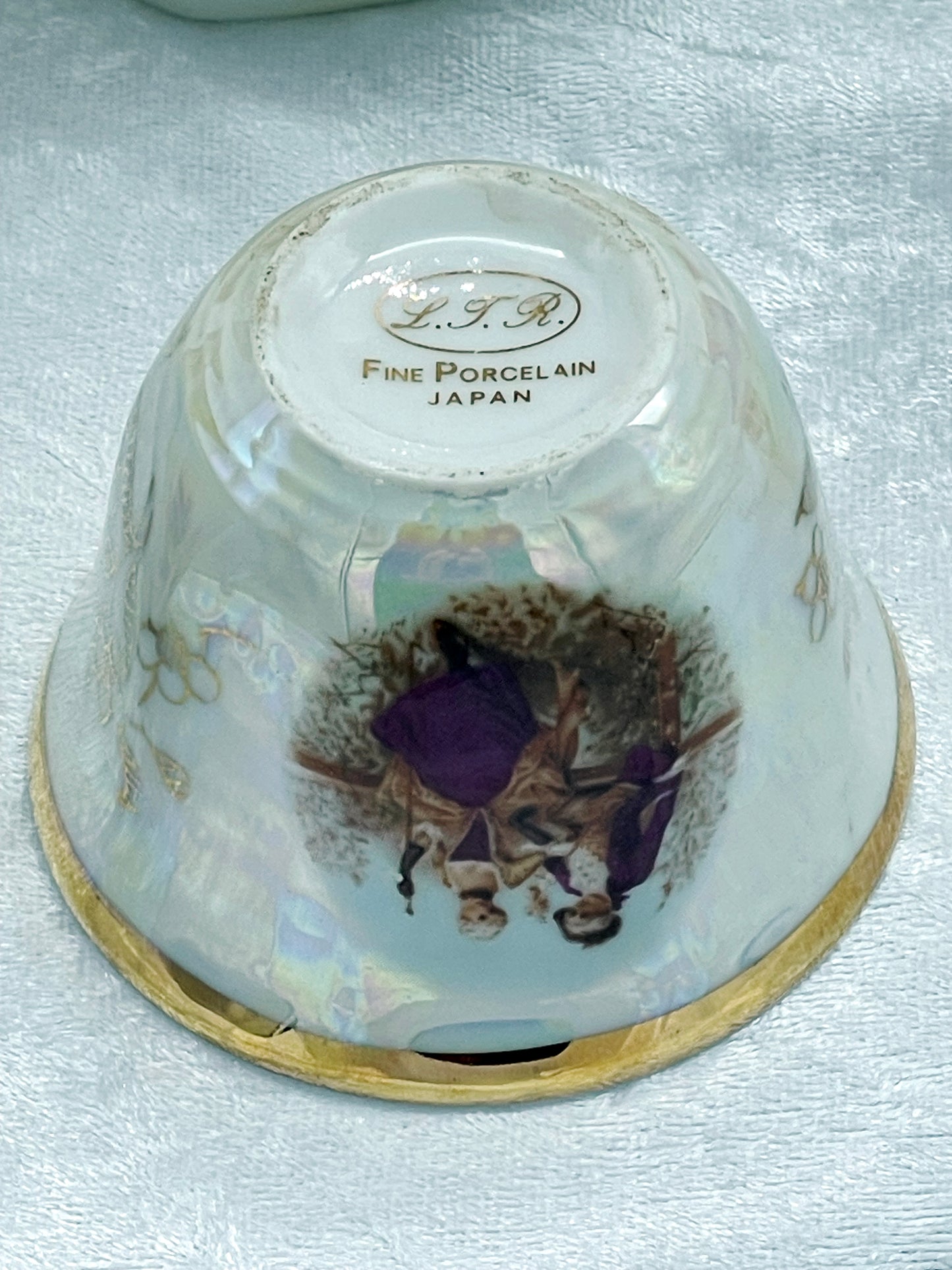 Underside maker's mark reading L.T.R. Fine Porcelain Japan in gold