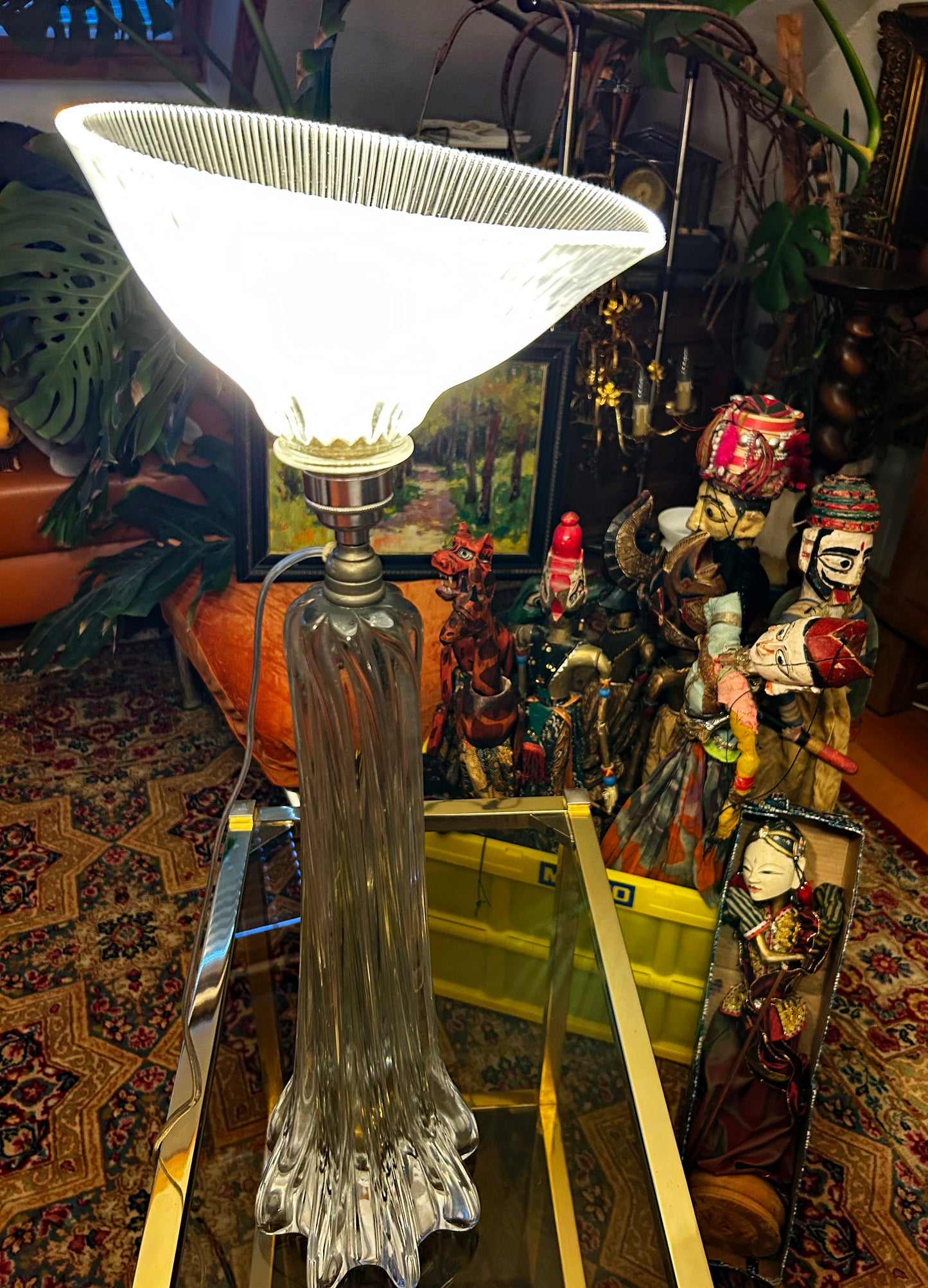 Illuminated lamp showing the fluted crystal column base and lit prismatic shade