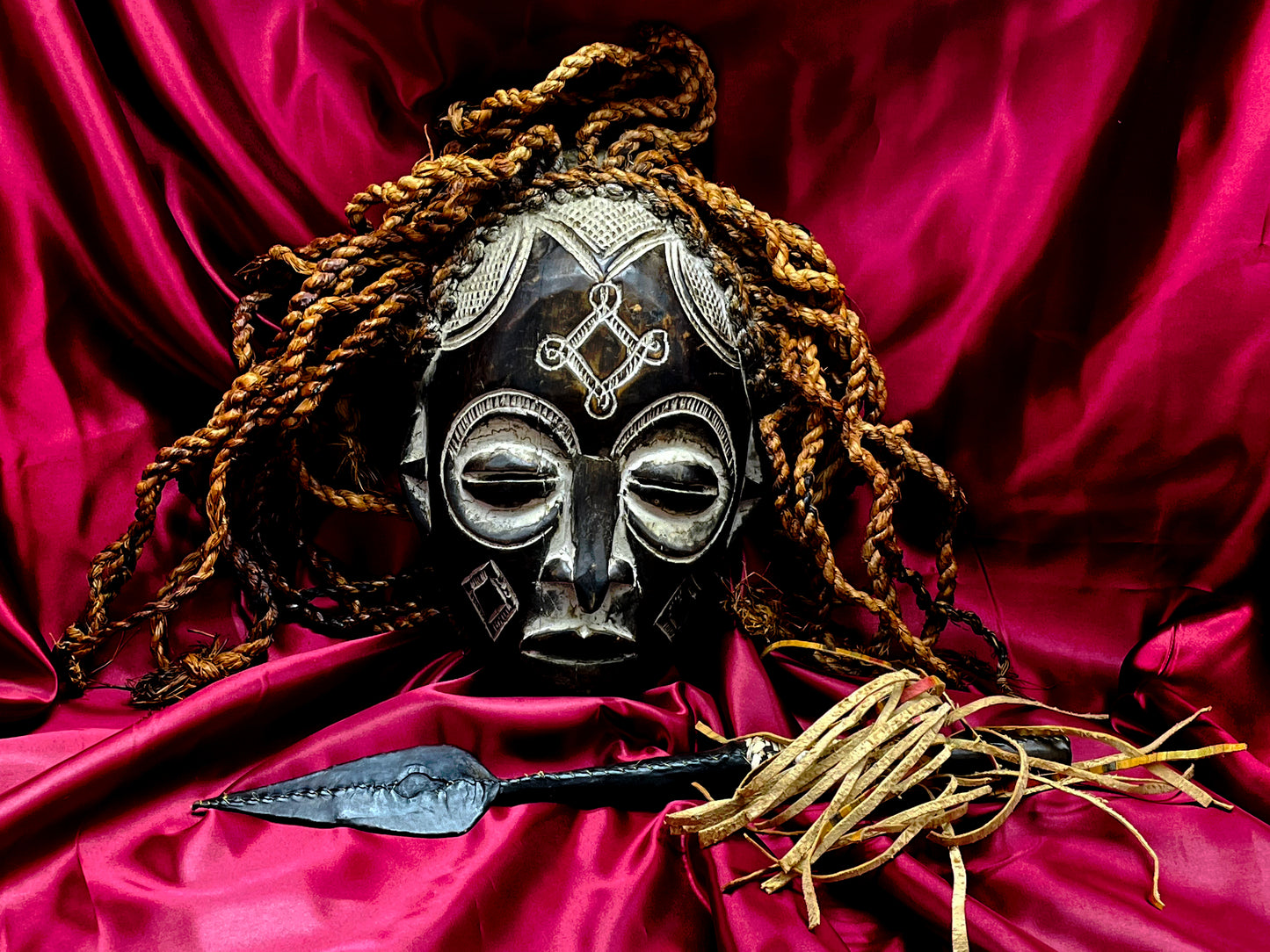 Mid-20th Century Chokwe Mask with Raffia Braids and Ceremonial Iron Arrow – Likely Congo