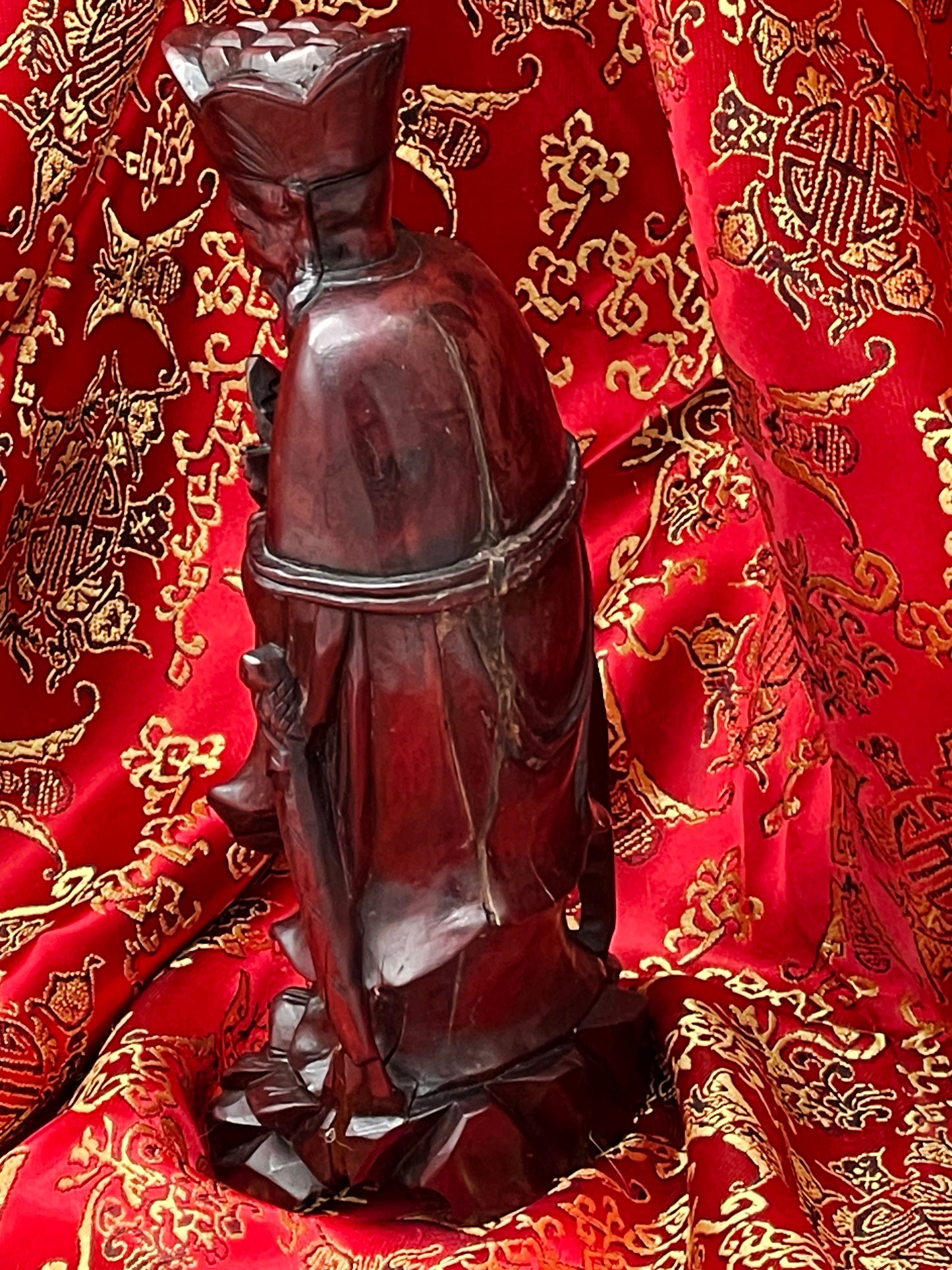 Base detail of Confucius wood sculpture