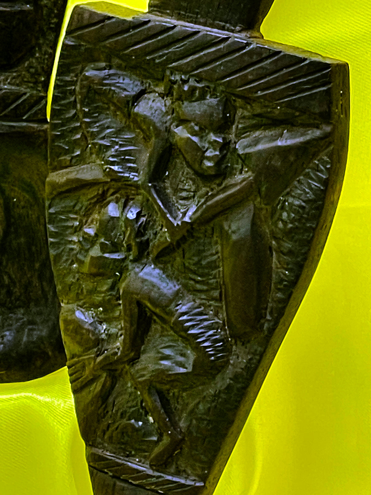 Detail view of the hand carved ebony utensil pair