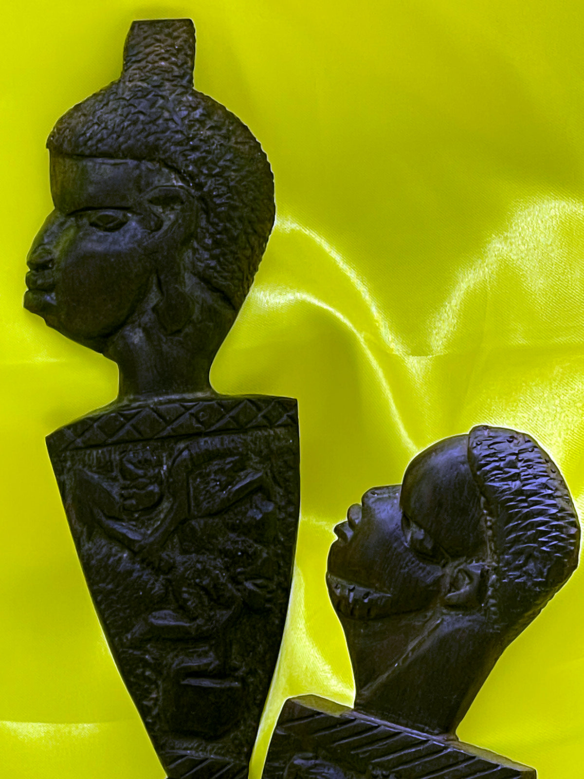 Angled view of the ebony spoon and fork carvings