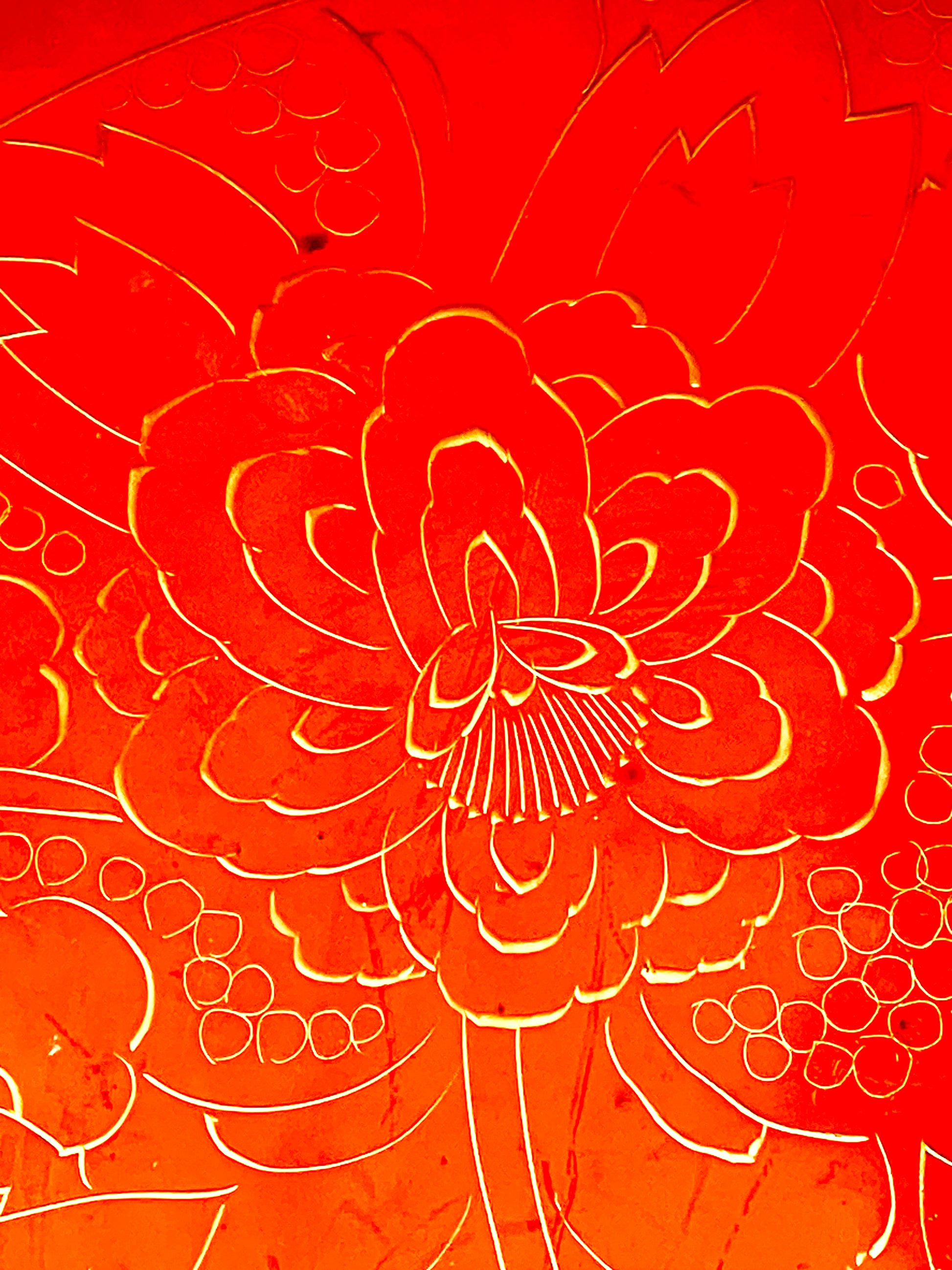 Close-up of an engraved gold peony bloom with fine stamen crown