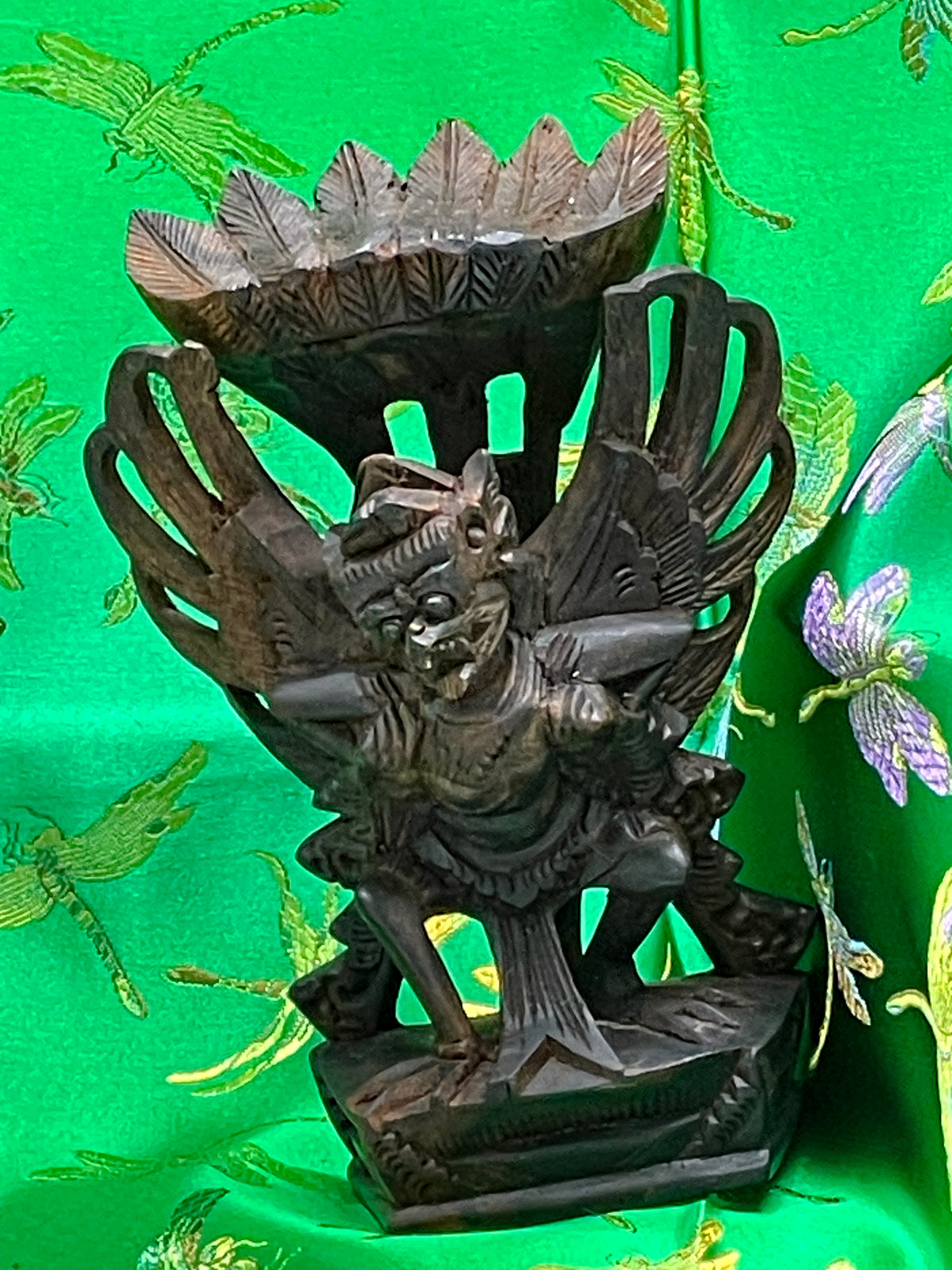 Front view of the antique Balinese Garuda carving showing openwork wings