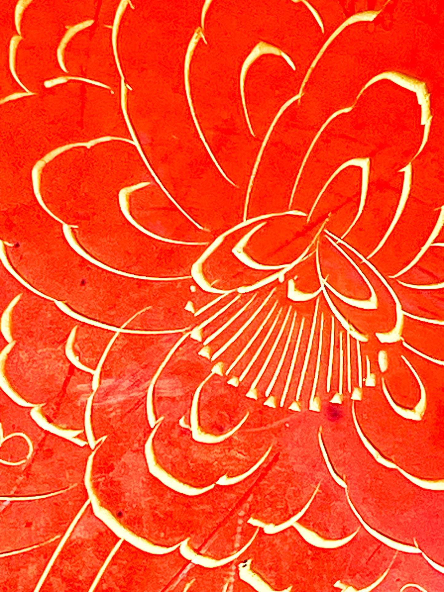 Detail of layered peony petals and fanned stamens in gold-filled engraving