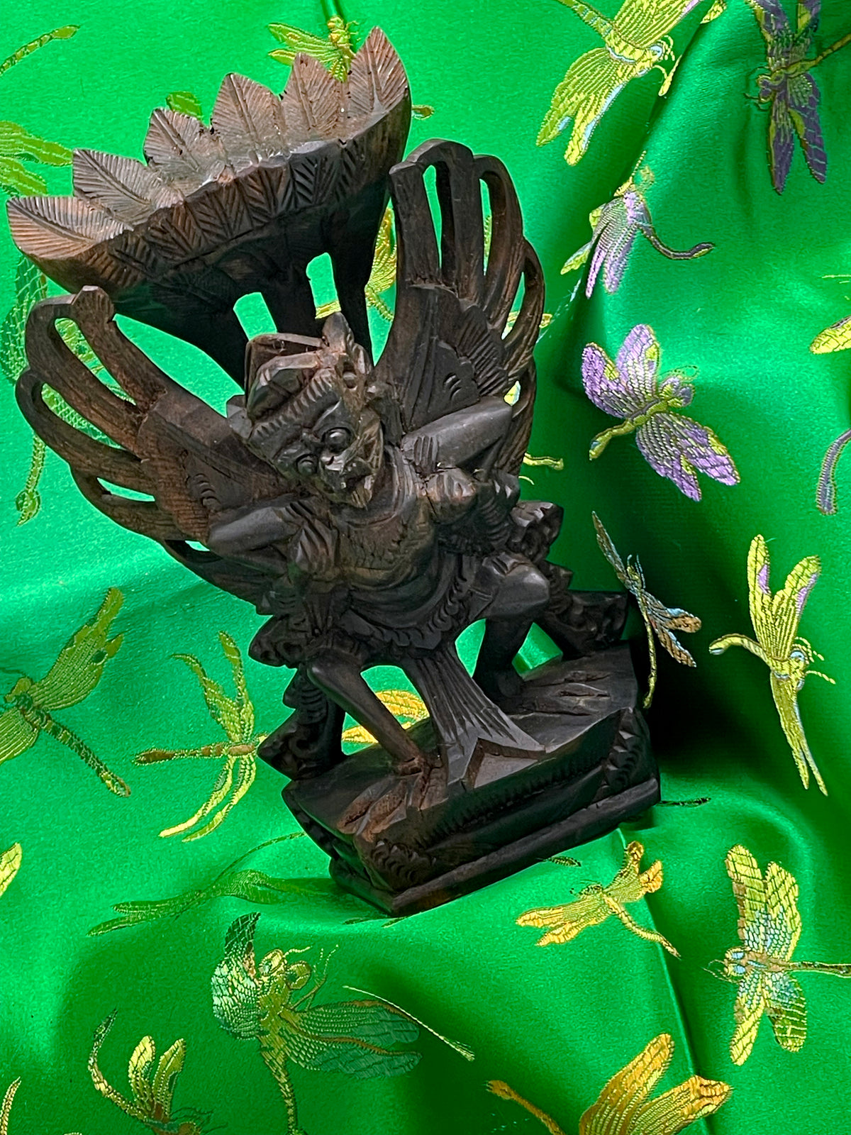 Detail of the carved wings and plumage of the ebony Garuda