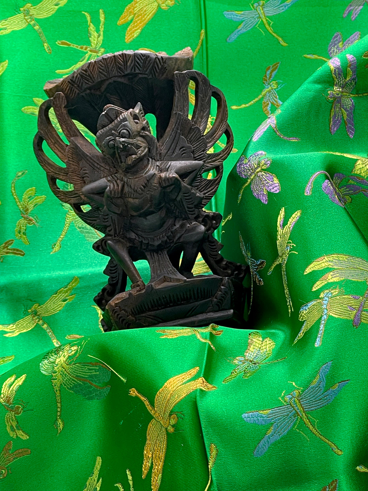 Further view of the Balinese flying Garuda carving showing patina