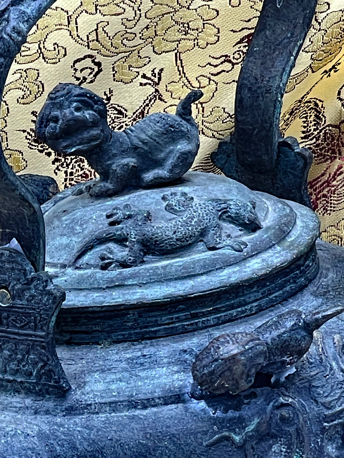 Detail of the domed lid with recumbent foo lion finial and spotted qilin in relief