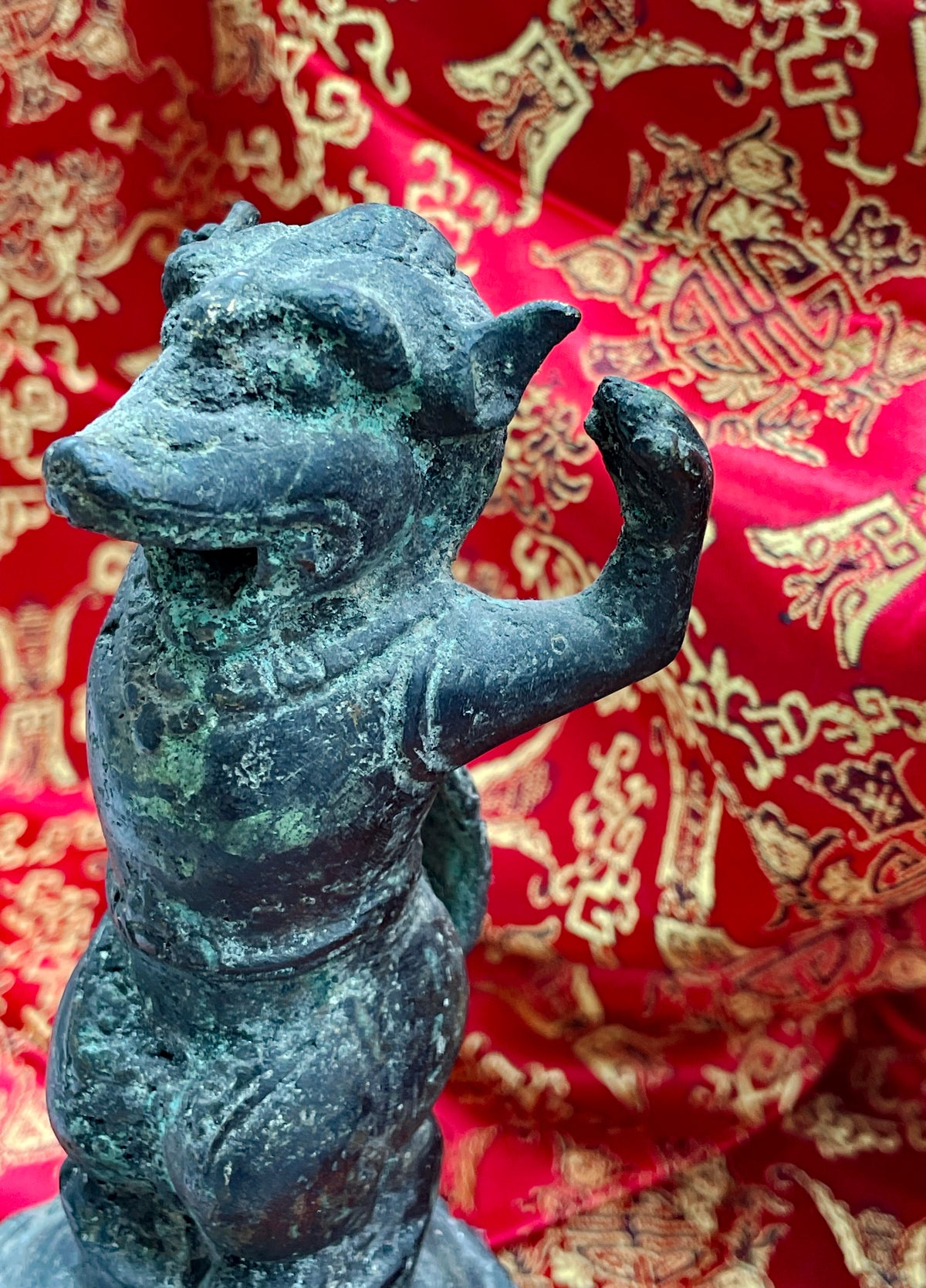 Frontal close up of the mythical guardian's head, antique Chinese bronze ritual bell