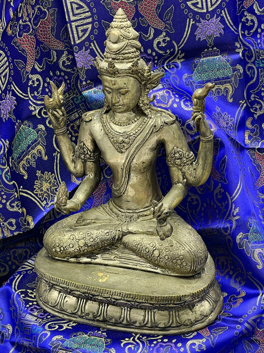 Antique Java style bronze Vishnu, four armed seated Hindu deity on lotus base, front view