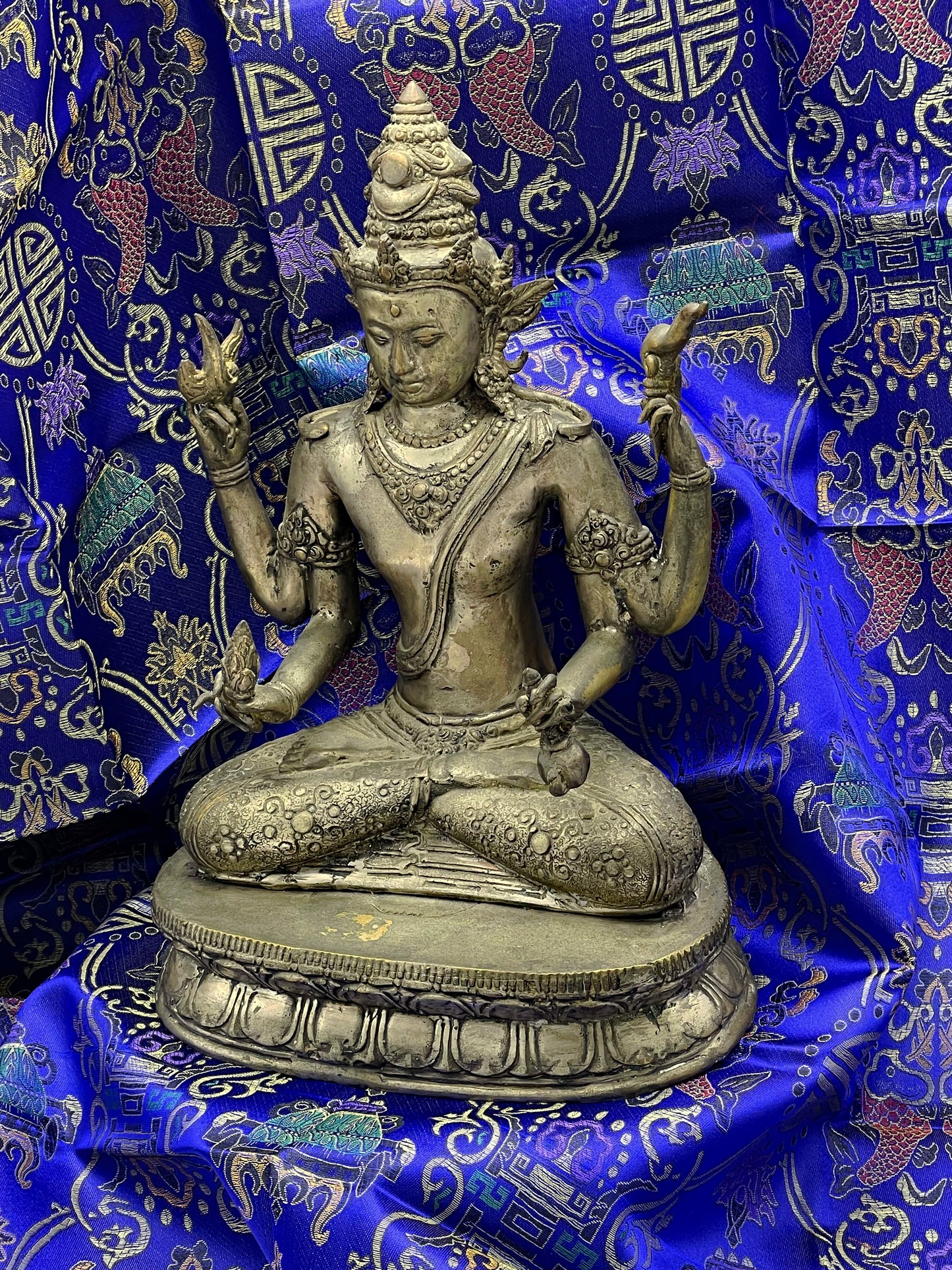 Java style bronze Vishnu figure, full front view showing four arms and ornate crown
