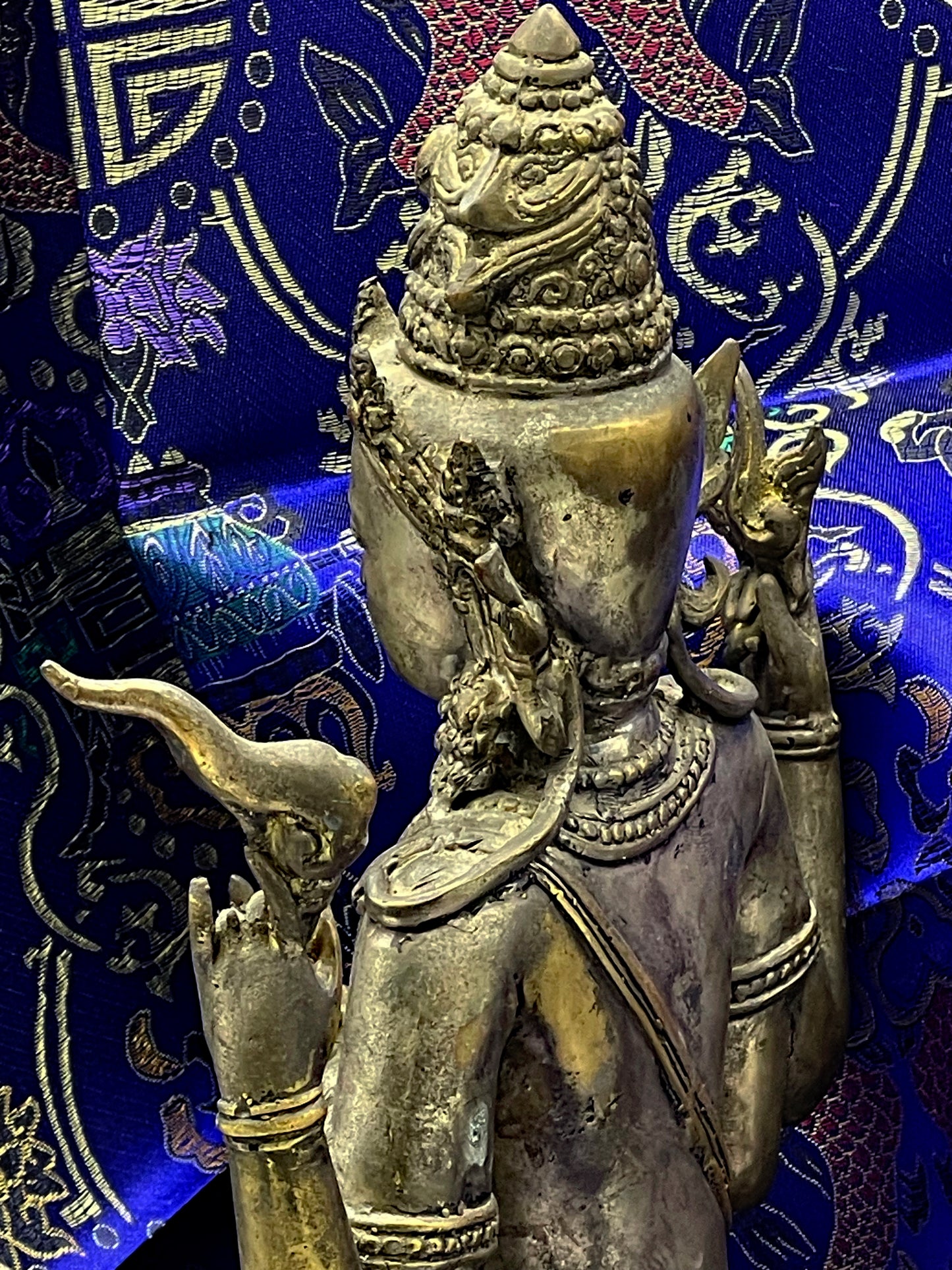 Rear three quarter view of bronze Vishnu showing crown and back detail
