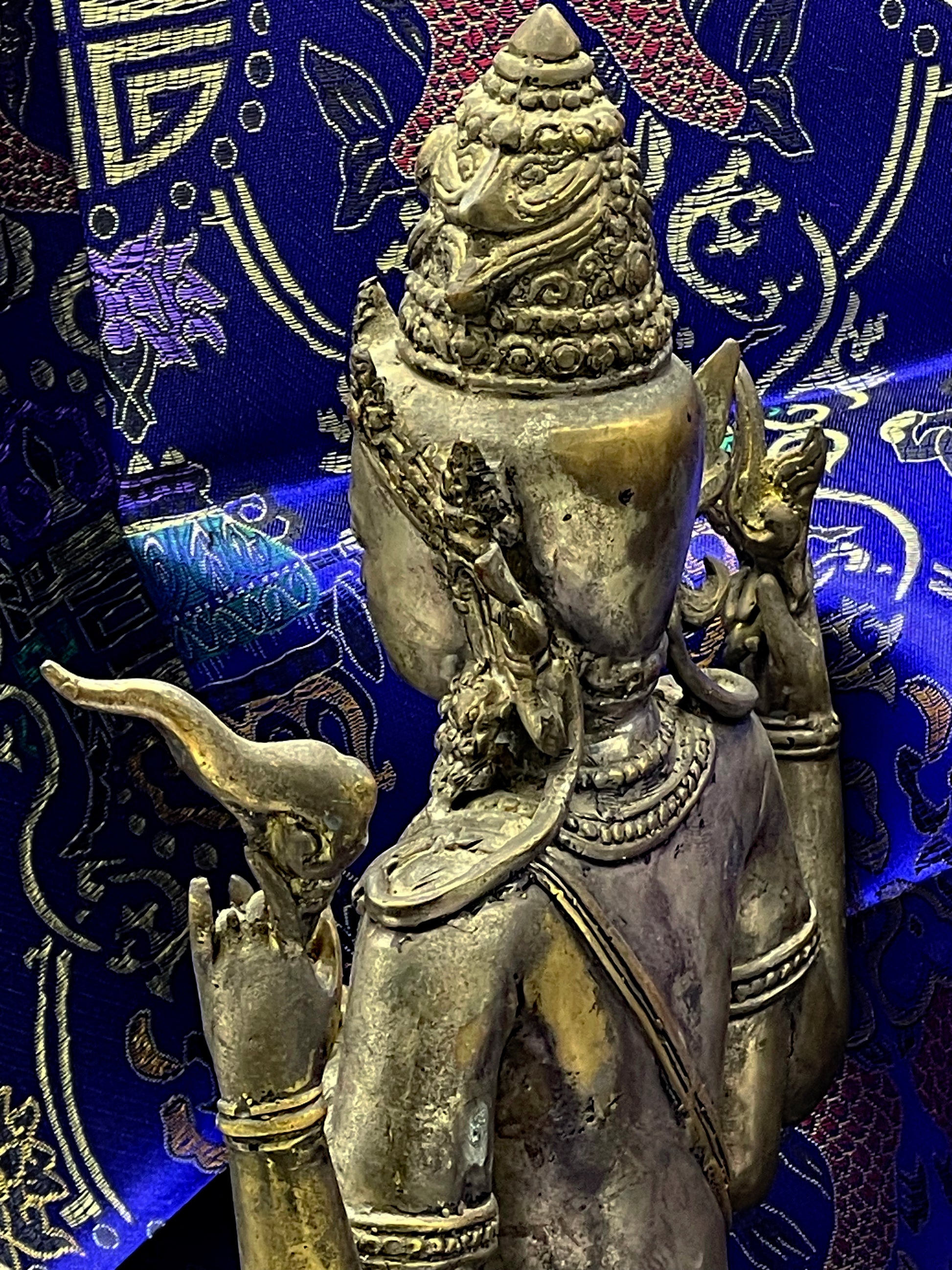 Rear three quarter view of bronze Vishnu showing crown and back detail