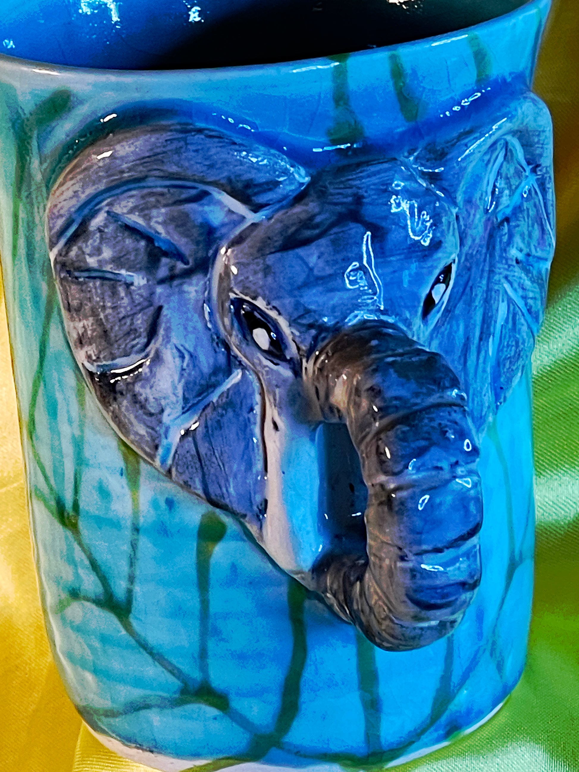 Alternate front angle of the signed Thai celadon elephant mug
