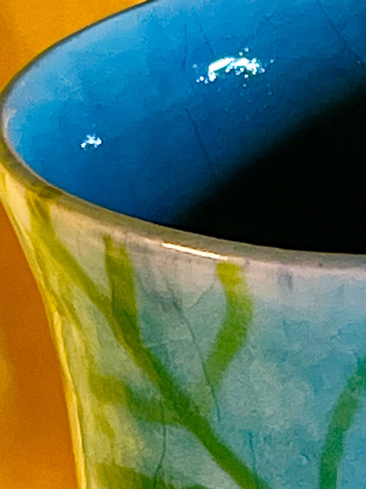 Rim and deep cobalt-blue glazed interior with green and turquoise crackle exterior