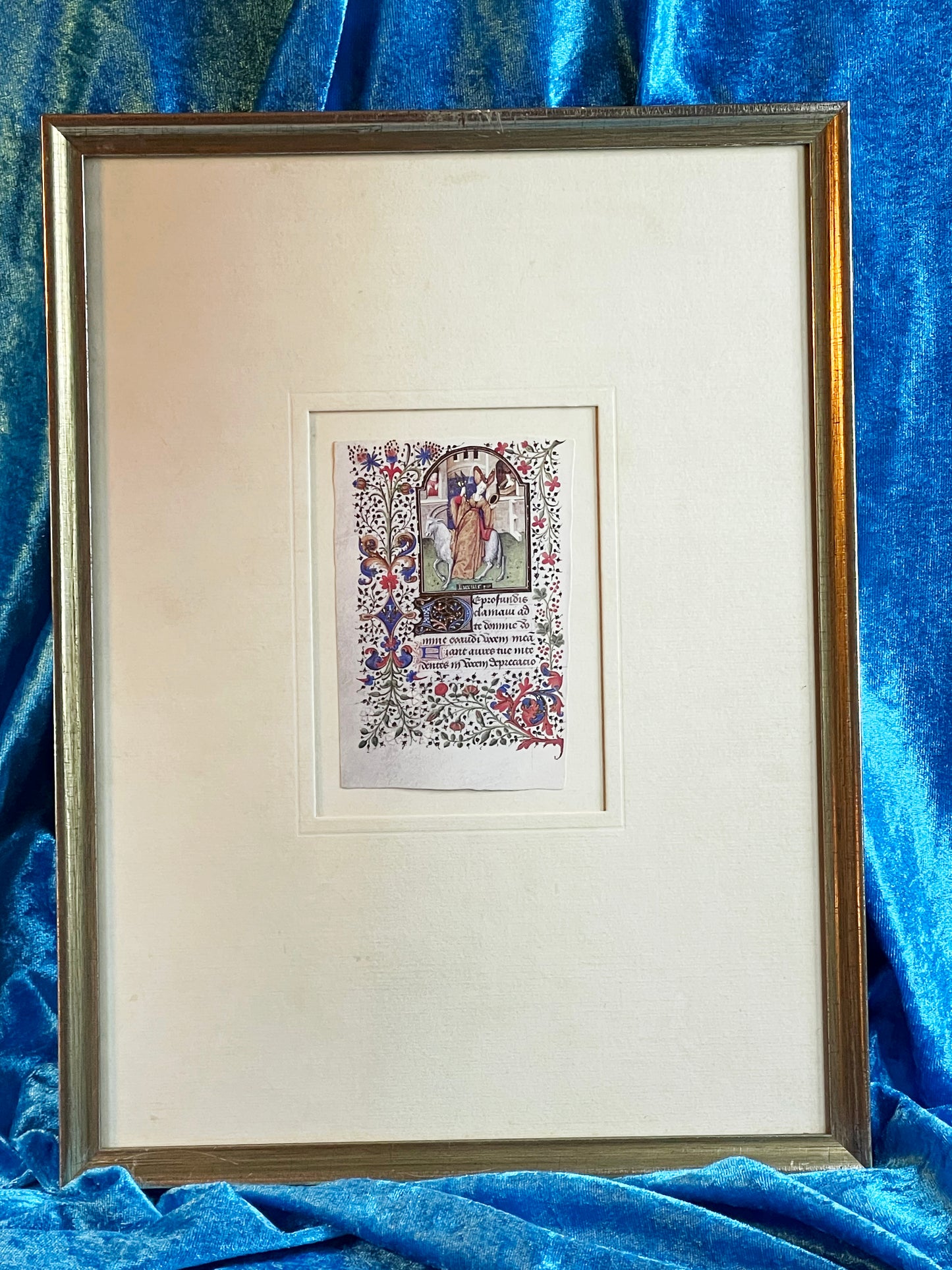 Framed Book of Hours miniature with saintly figure and Latin Gothic script in a silvered frame