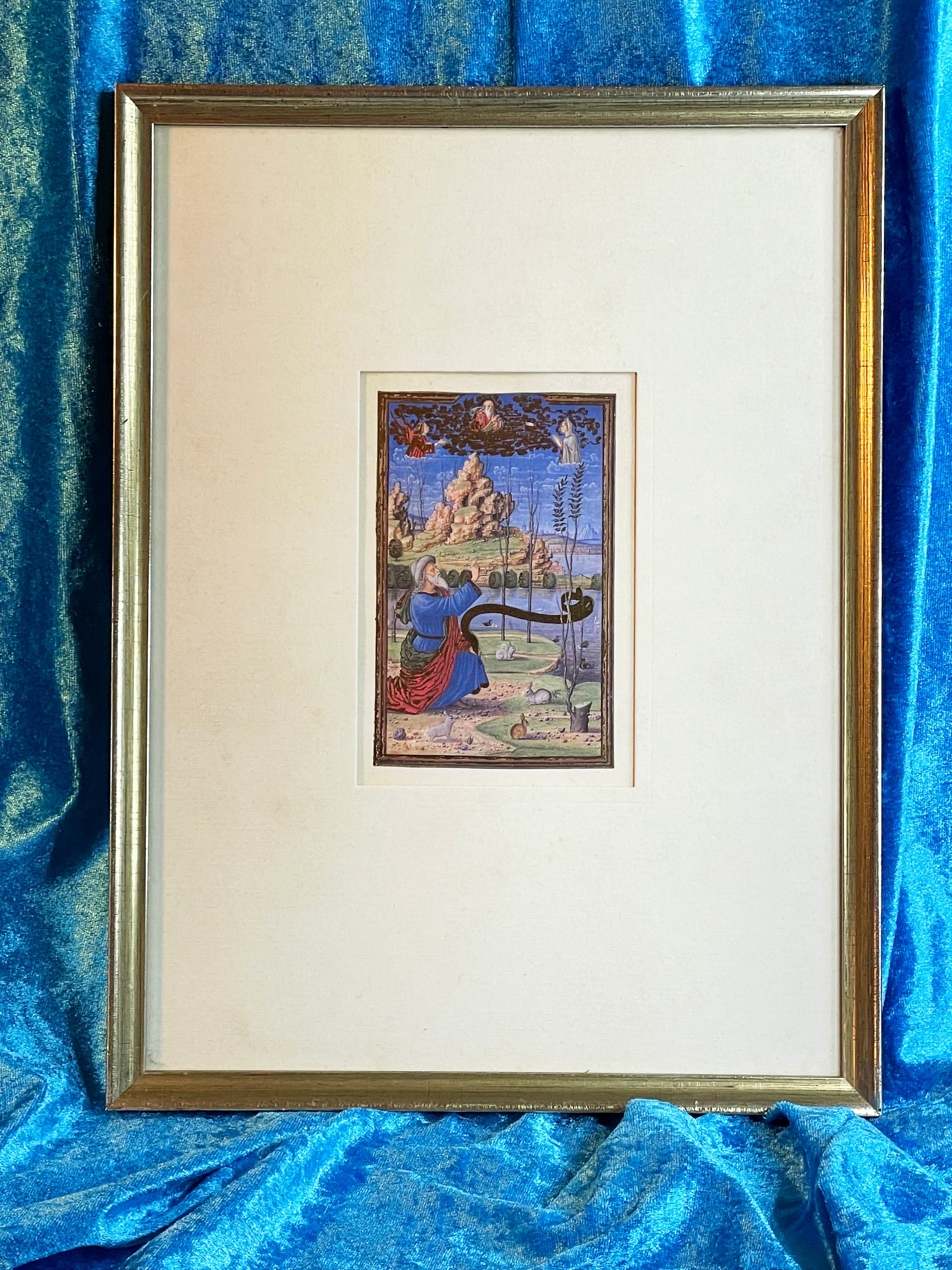 Illuminated miniature of a figure praying in a blue and gold landscape, silvered frame