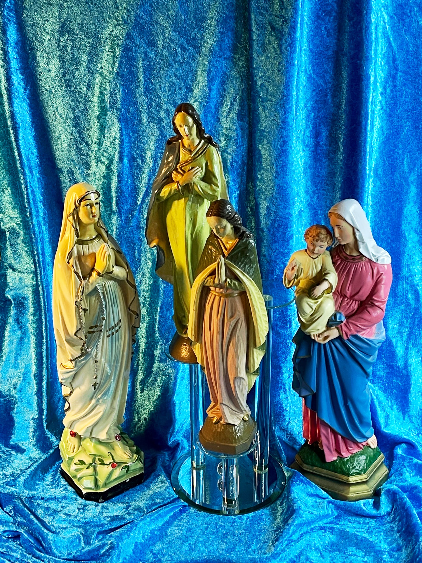 Set of four vintage polychrome hand-painted plaster religious figures grouped together
