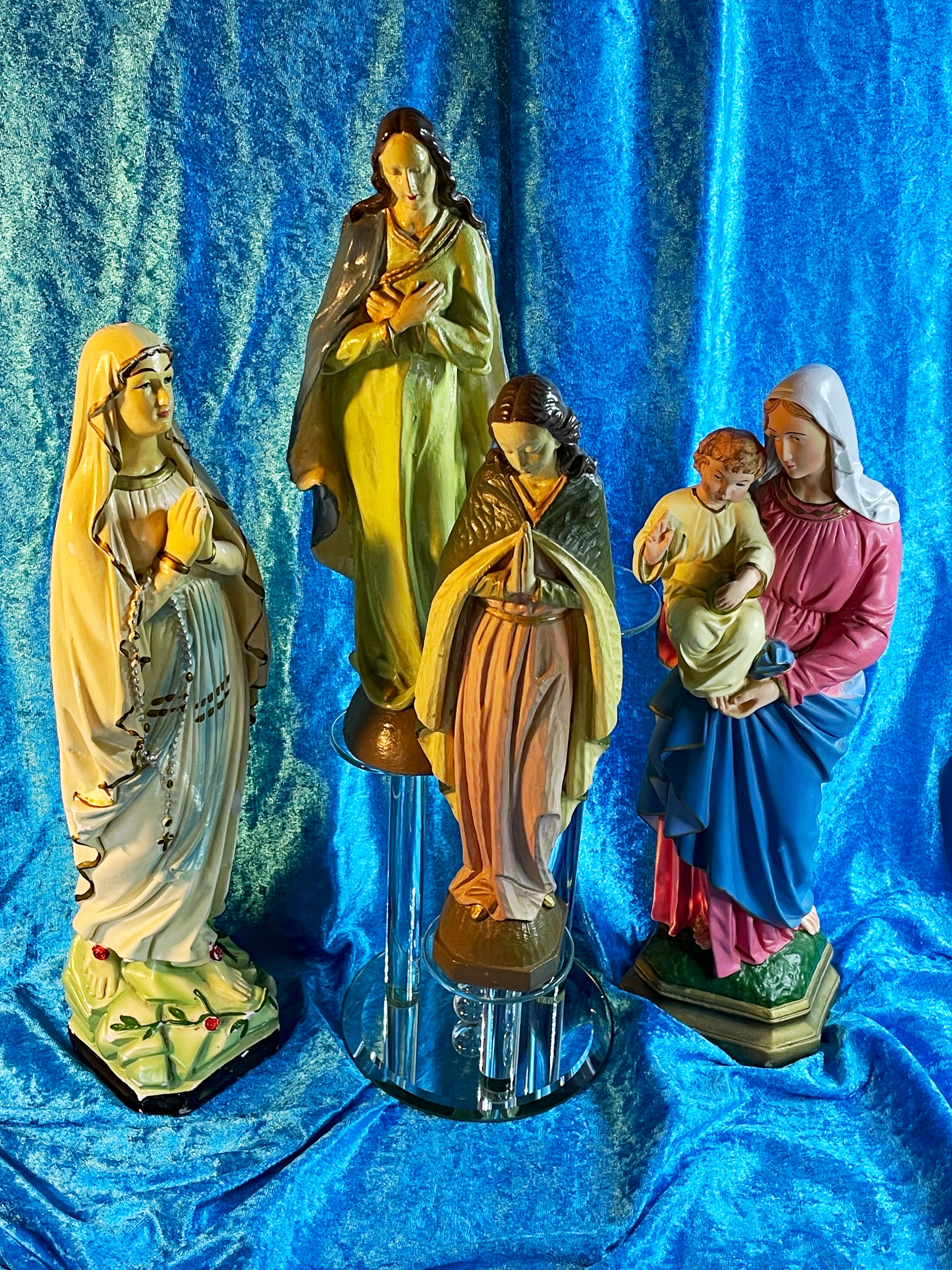 Alternate view of the four hand-painted plaster Madonna and saint figures