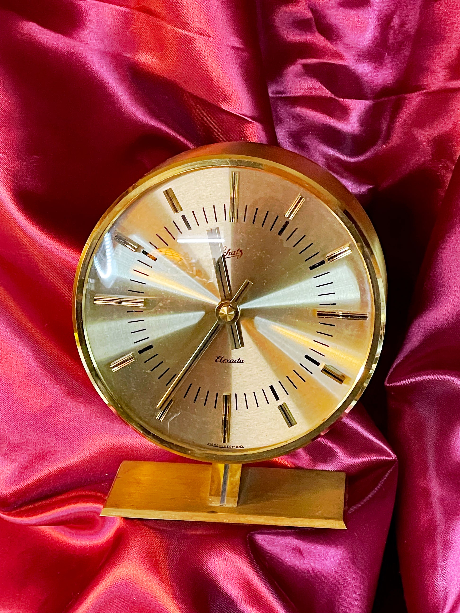 Schatz Elexacta solid brass drum table clock with sunburst dial, front view