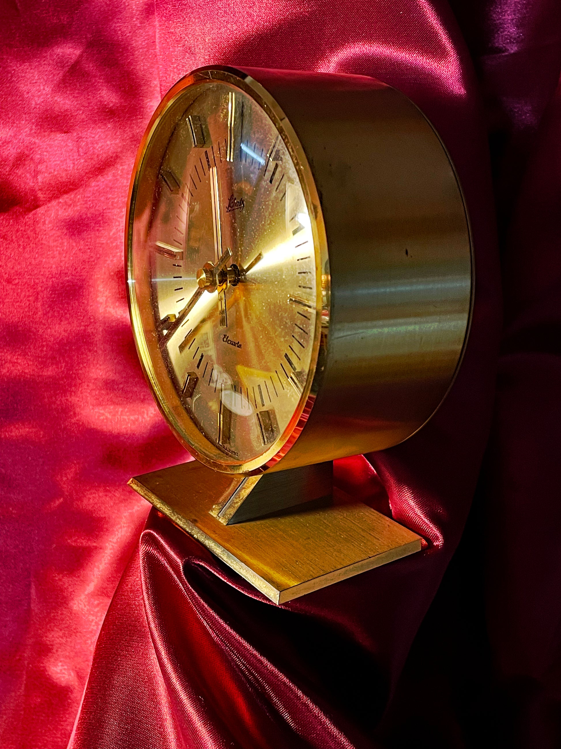 Schatz Elexacta brass clock left profile on faceted pedestal base
