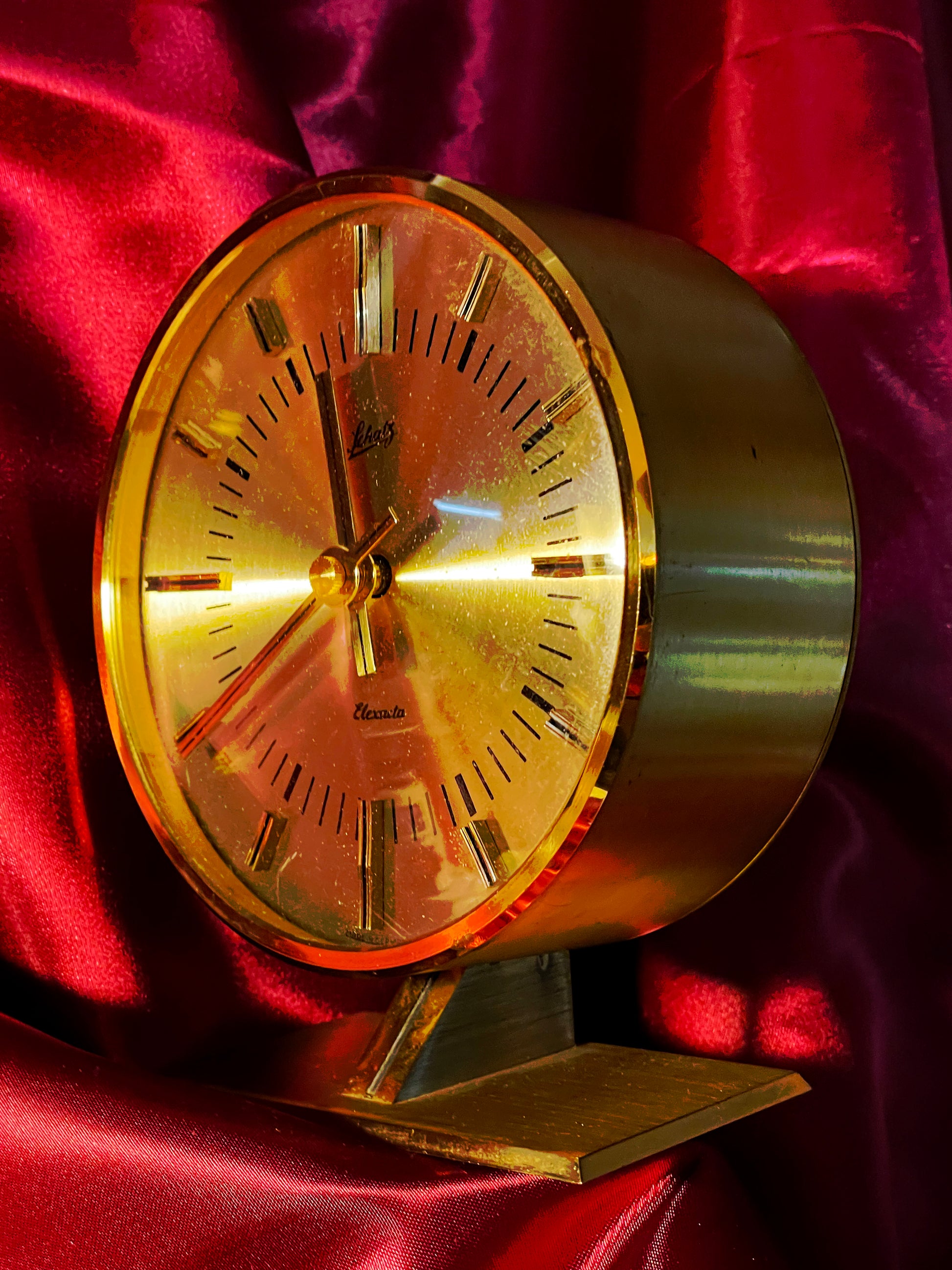 Brass Schatz table clock three-quarter right view showing drum case depth