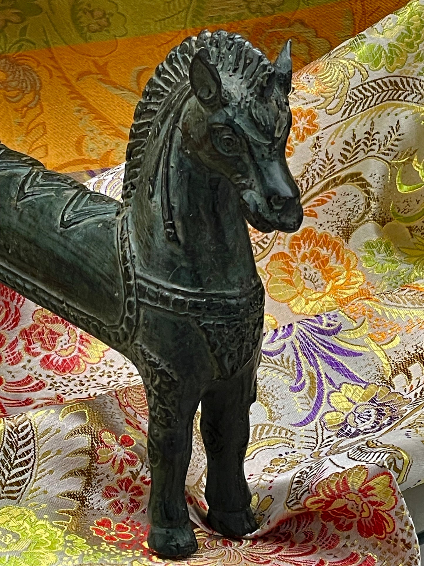 Detail of the head and neck showing carved mane and bridle