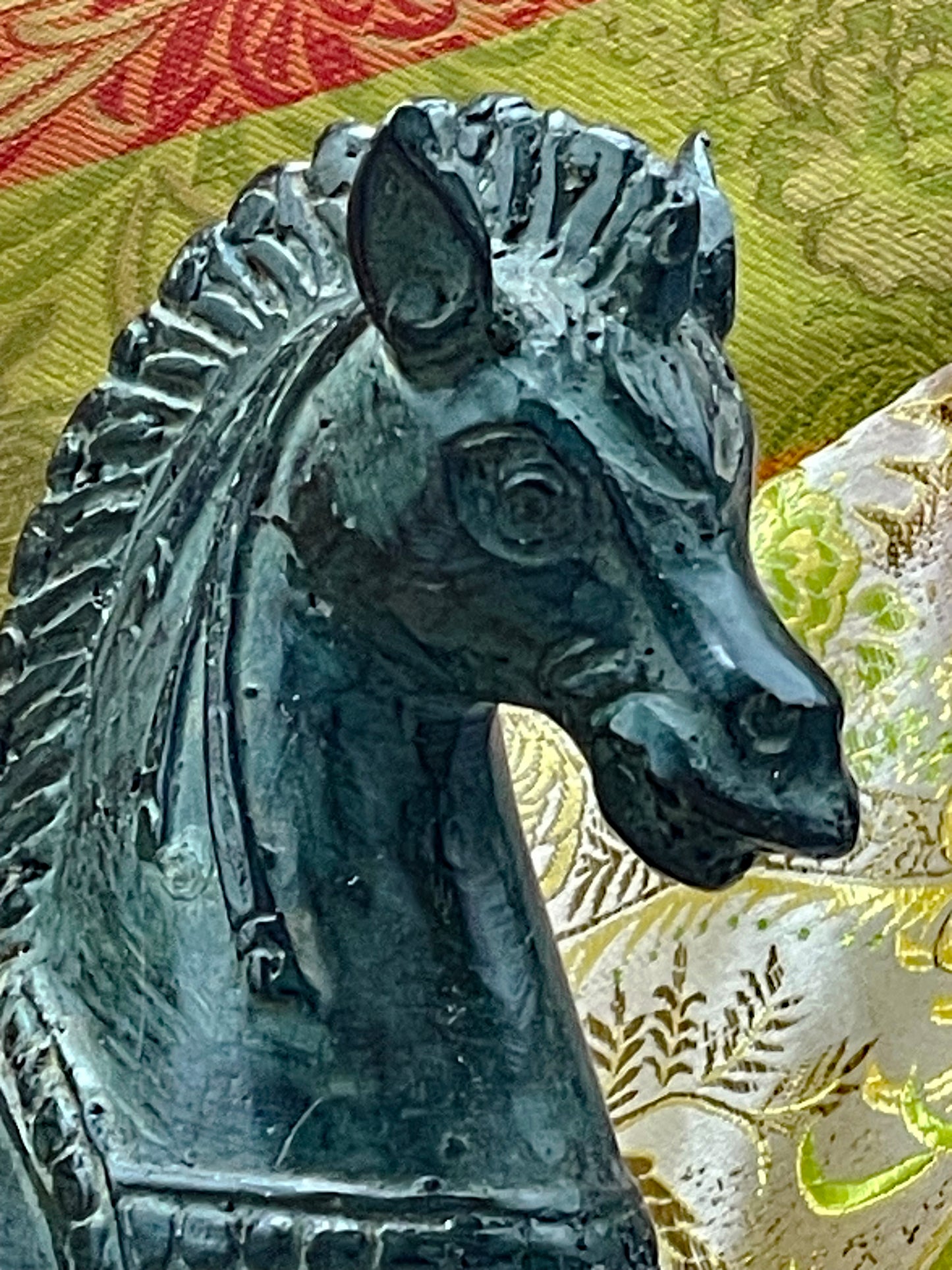 Close-up of the horse head showing eye, ears and patina
