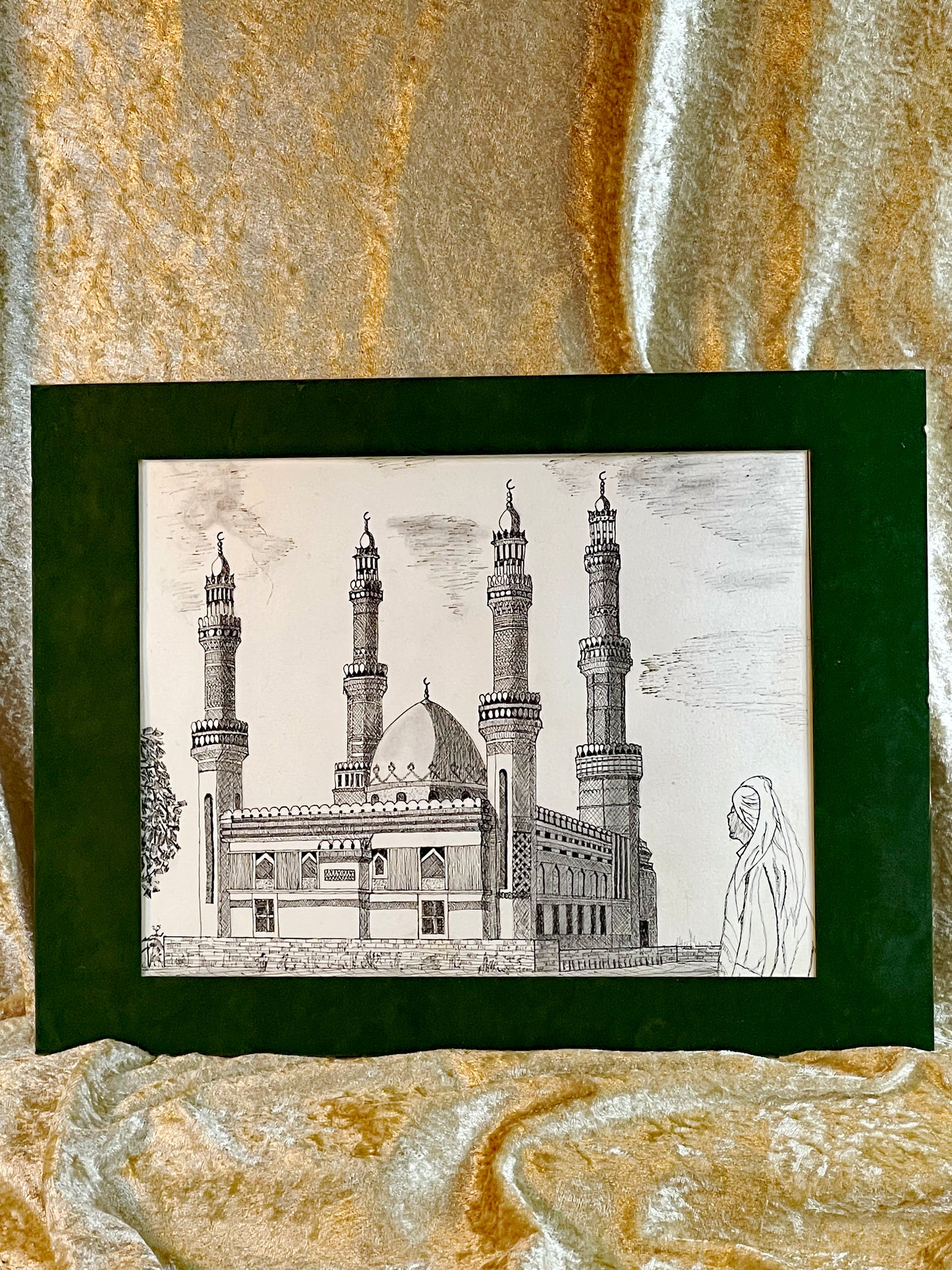 Original 1980s pen and ink drawing of a Turkish mosque with four minarets and a veiled figure, in a dark green velvet mount