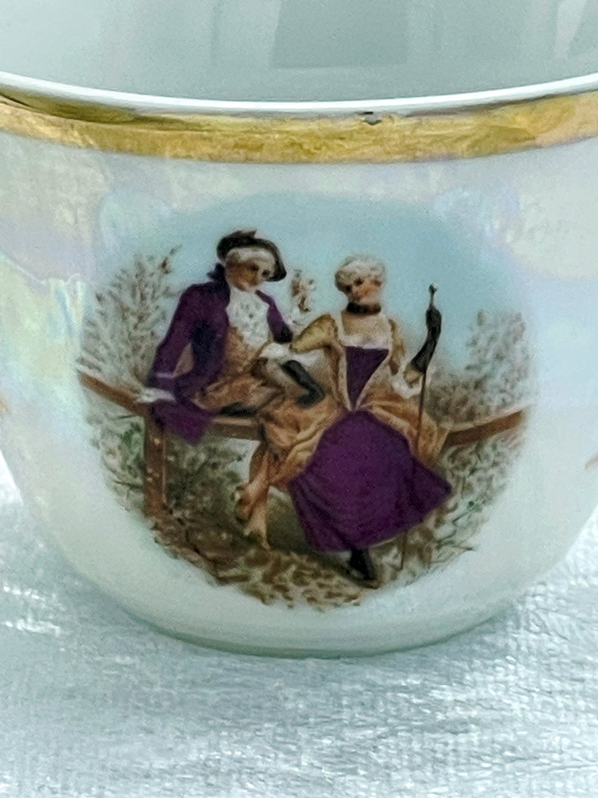 Close-up of Fragonard courting couple transfer in plum and gold