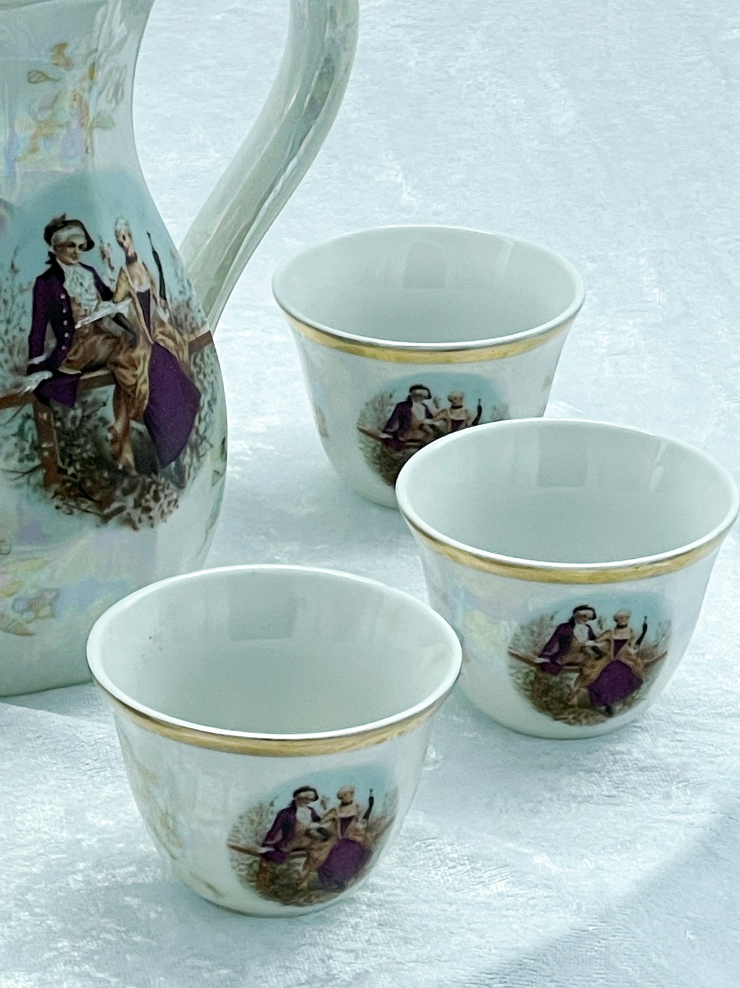 Lustreware coffee pot grouped with three mocha cups, Japan
