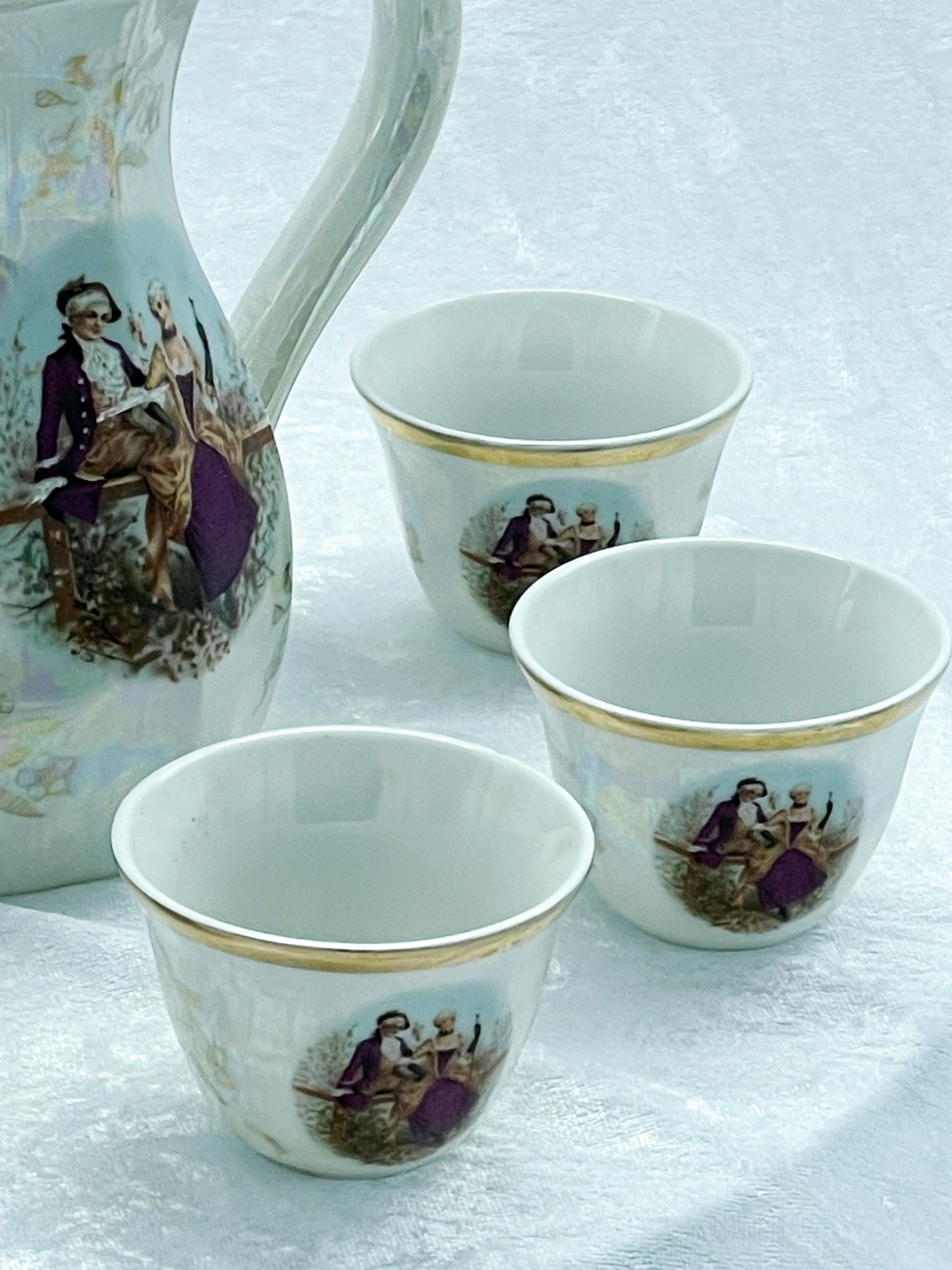 Lustreware coffee pot grouped with three mocha cups, Japan
