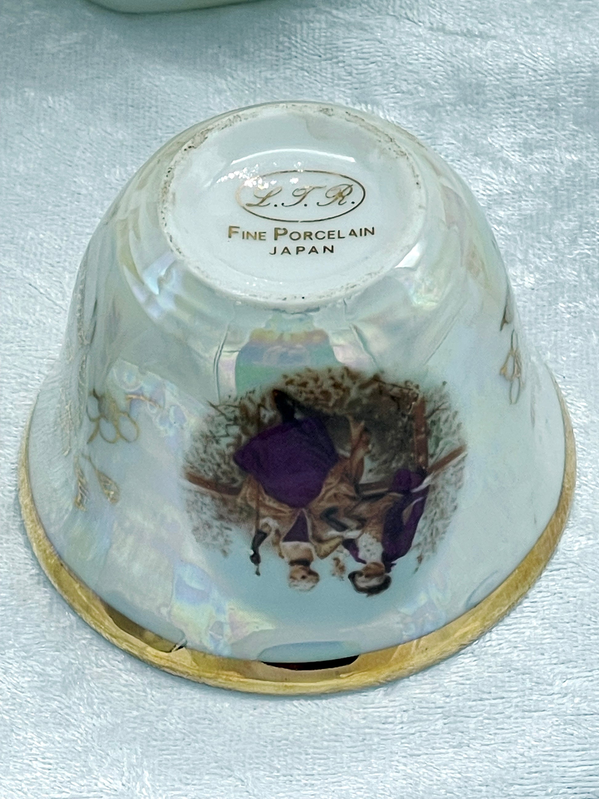 Underside maker's mark reading L.T.R. Fine Porcelain Japan in gold