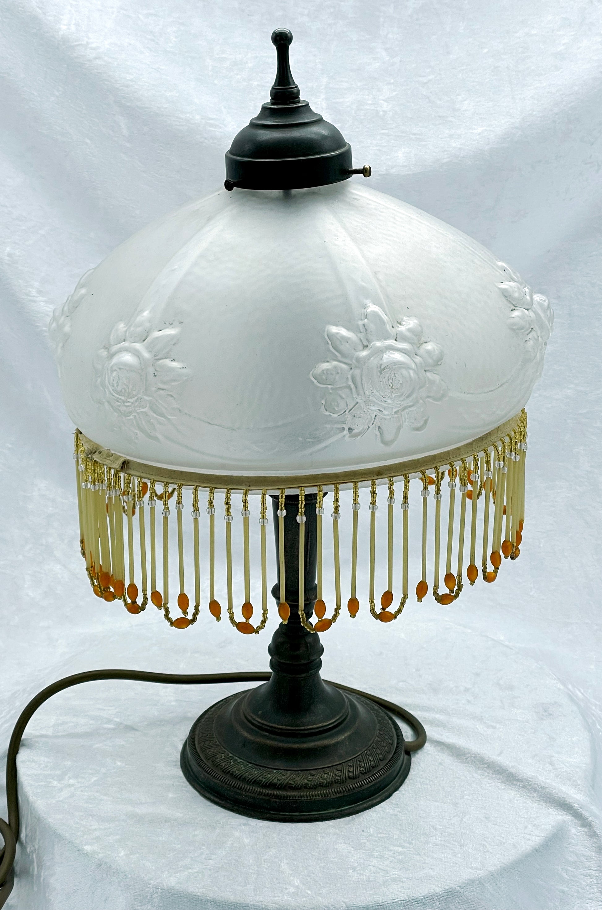 Vintage French boudoir table lamp with frosted rose glass shade and amber beaded fringe, full view
