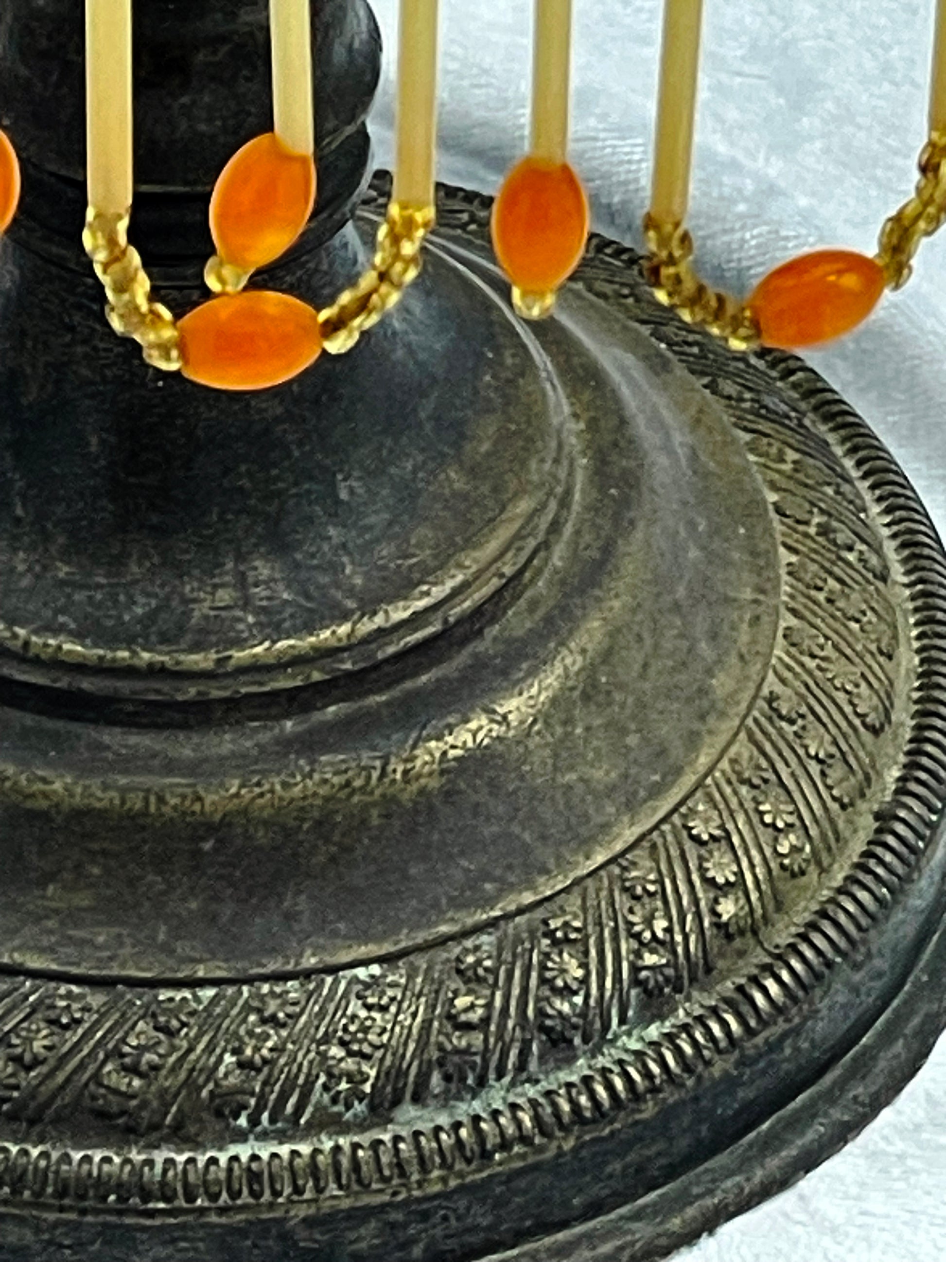 Decorative cast metal lamp base with finely chased ornamental band around the foot