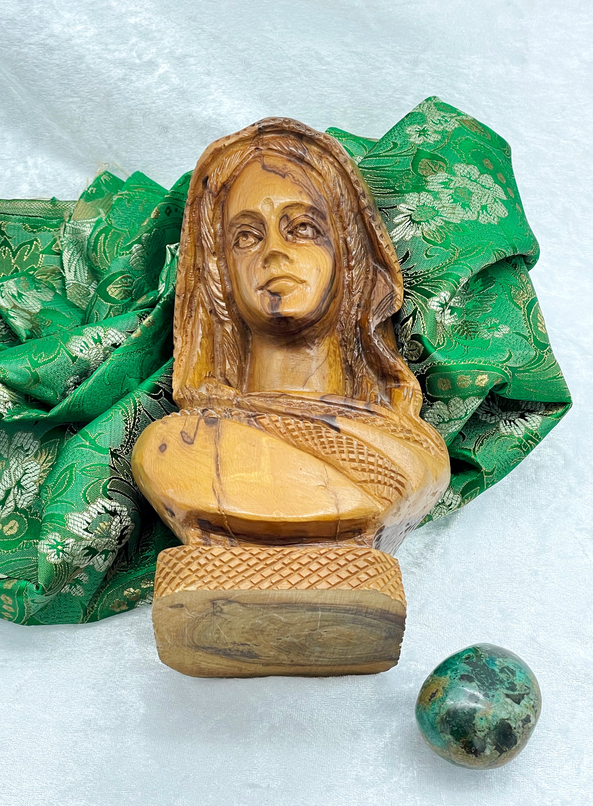 Full view of wooden Indian woman bust showing carved plinth base
