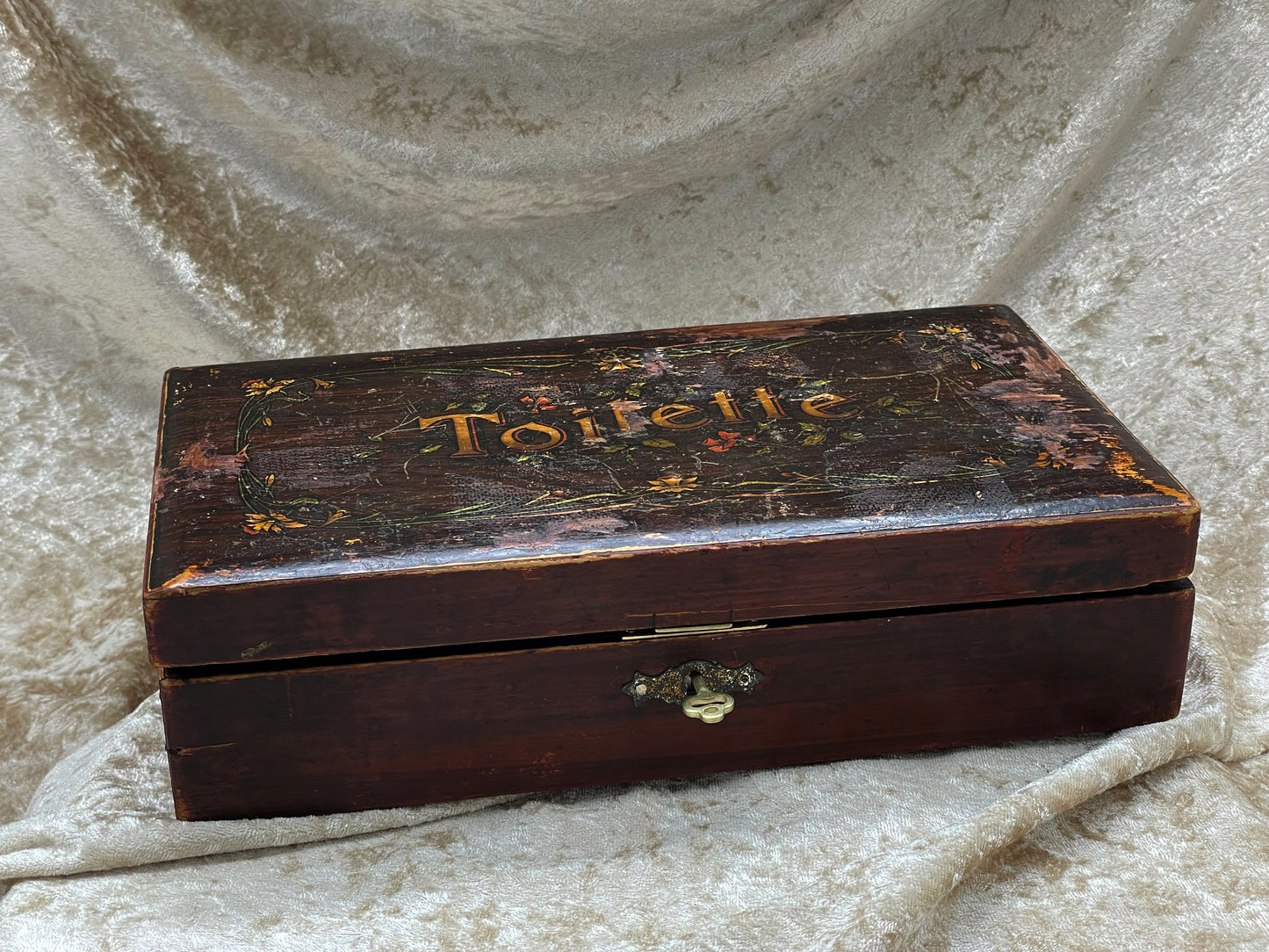 French painted vanity box at three-quarter angle showing brass lock and key