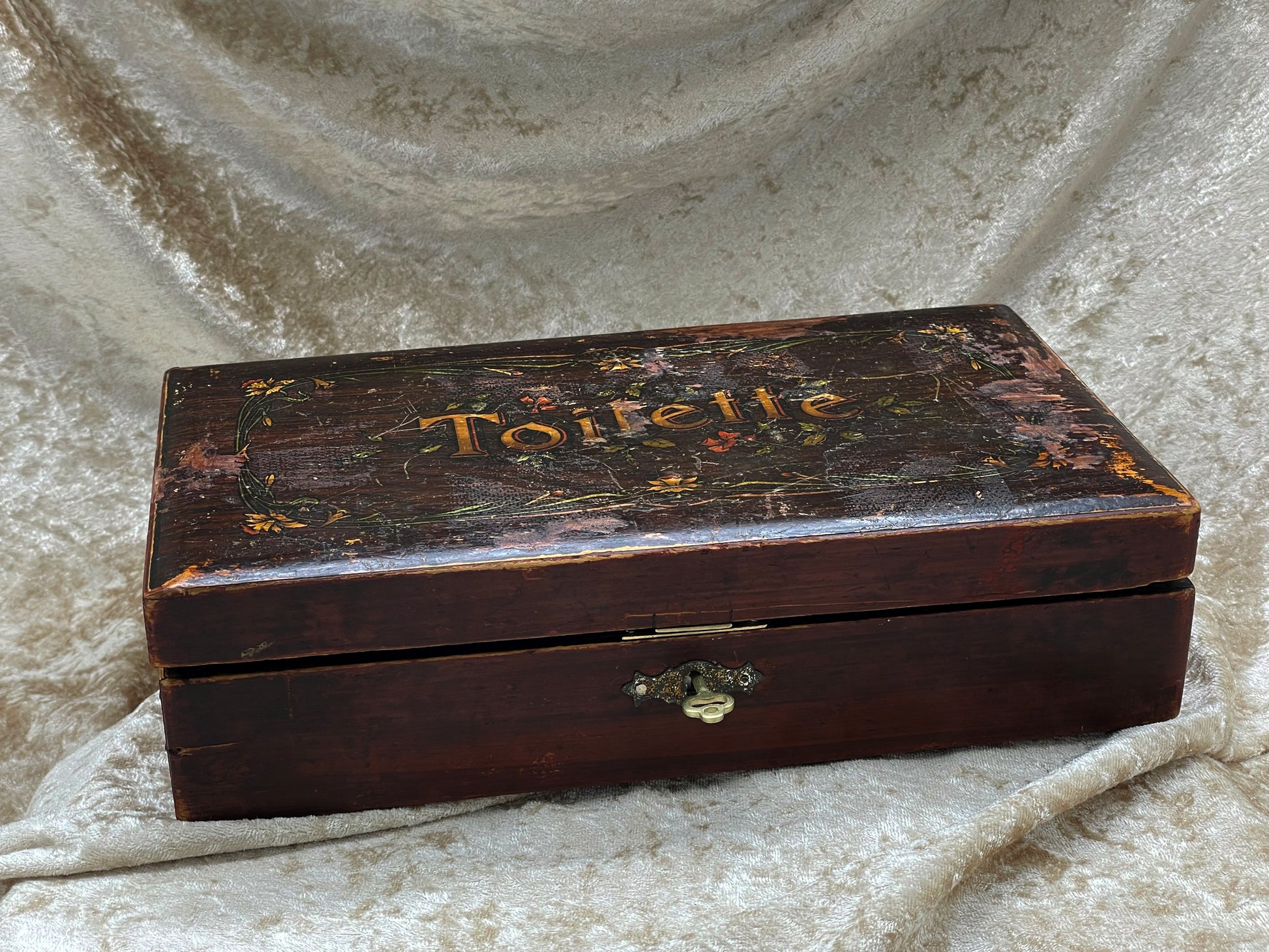 French painted vanity box at three-quarter angle showing brass lock and key