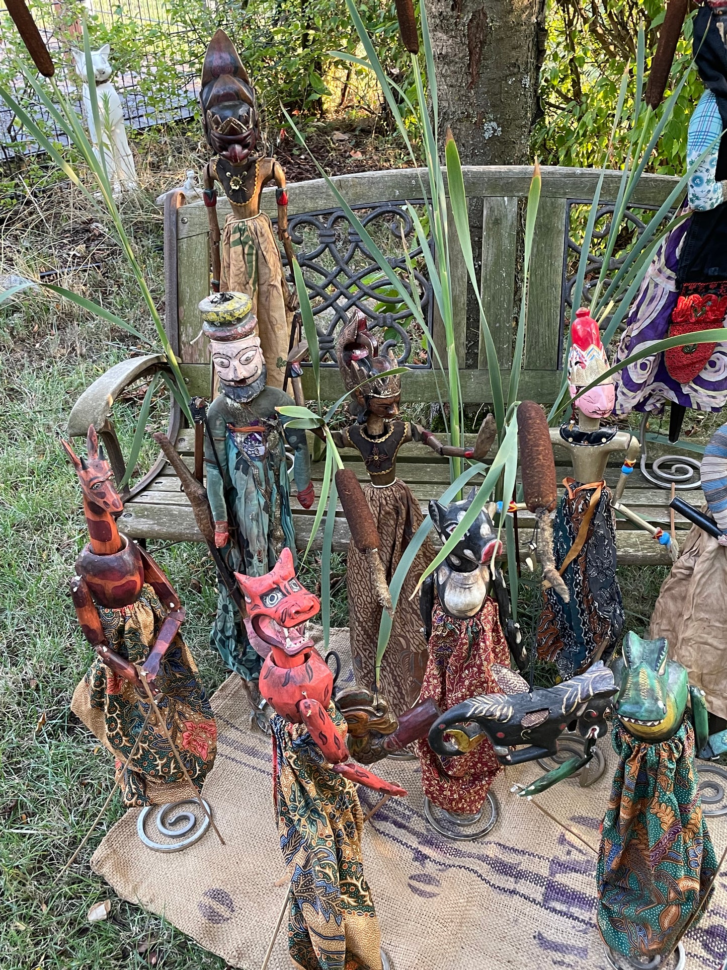 Group of old Wayang Golek rod puppets from Java arranged upright