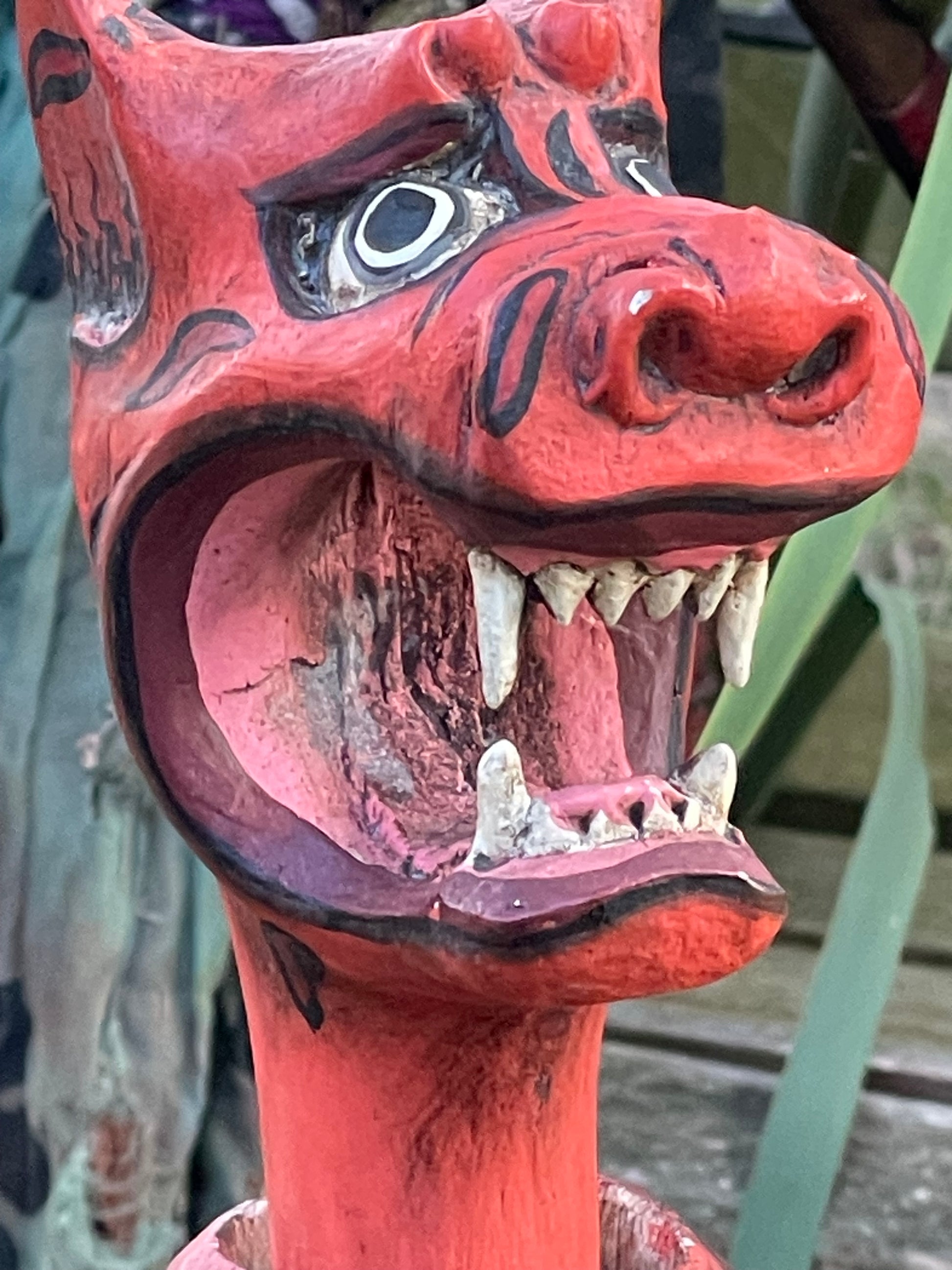 Red demon Wayang Golek character puppet with carved fangs, Javanese folk art