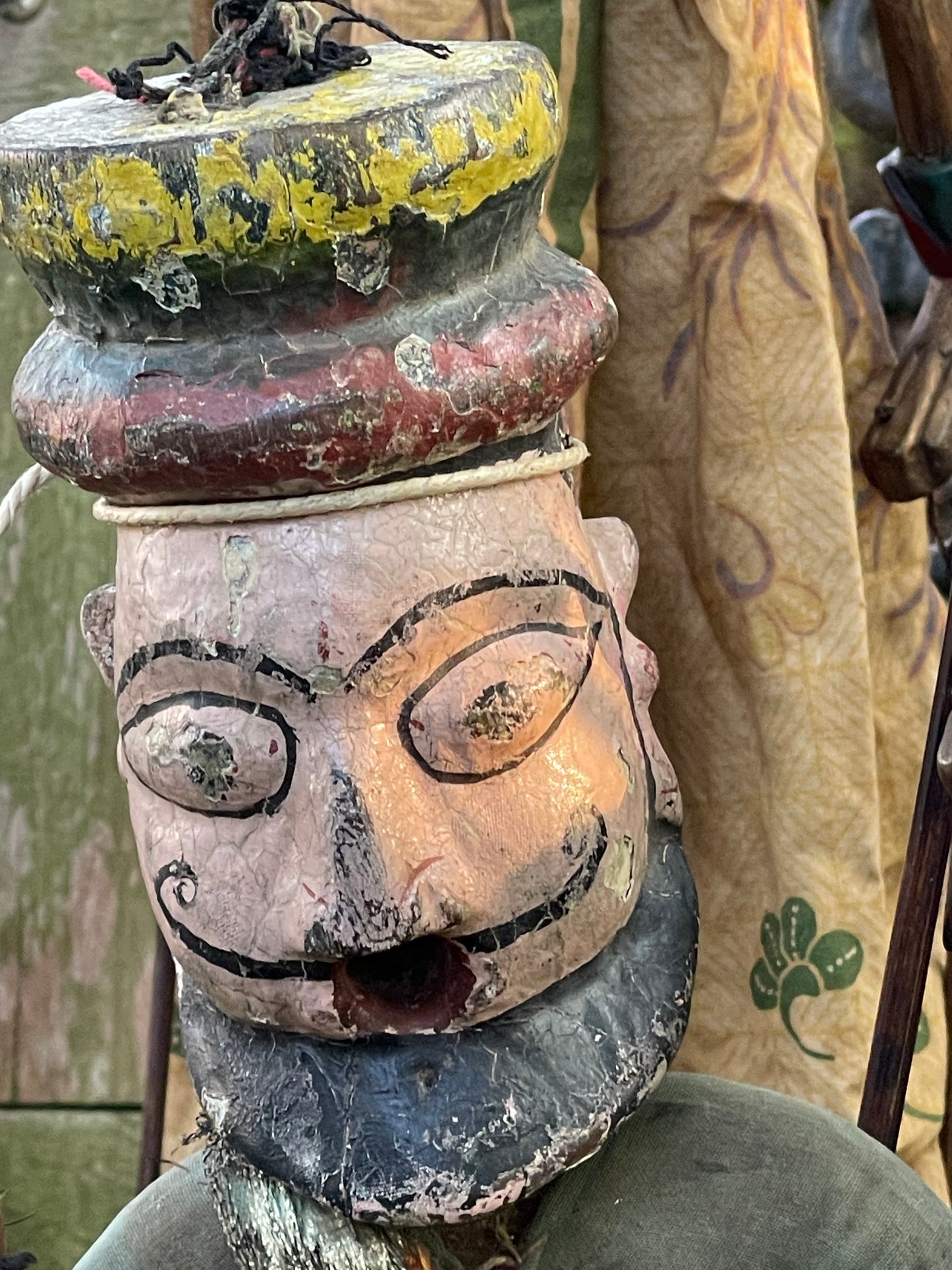 Wayang Golek puppet with blue floral headdress and detailed batik dress