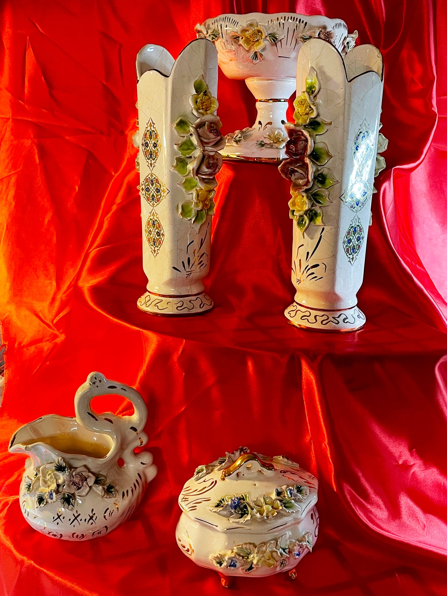 Full five piece porcelain set, two vases, compote, lidded box and ewer on red ground