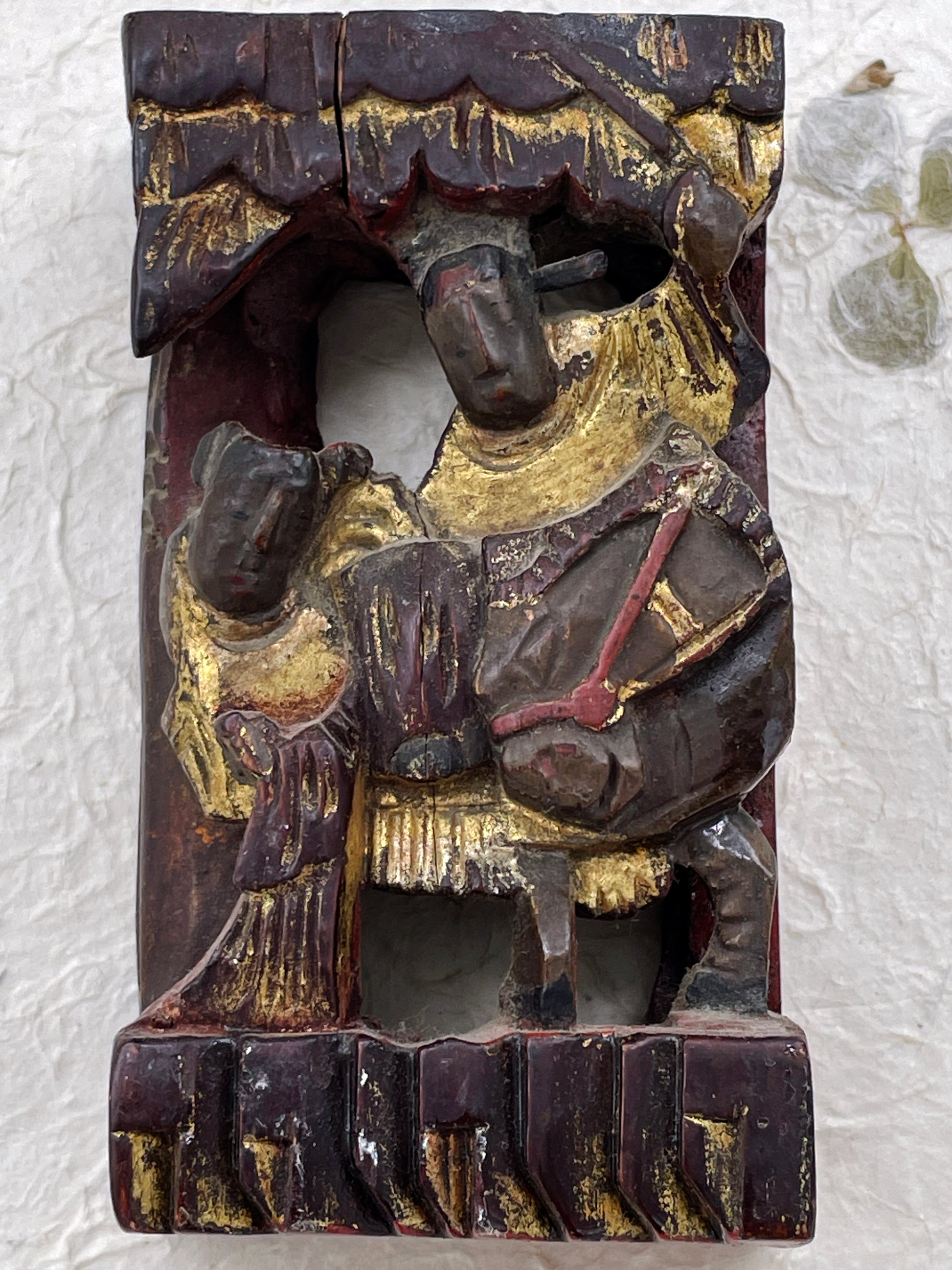 Antique Chinese carved wood collectible with gilded figures and original red paint