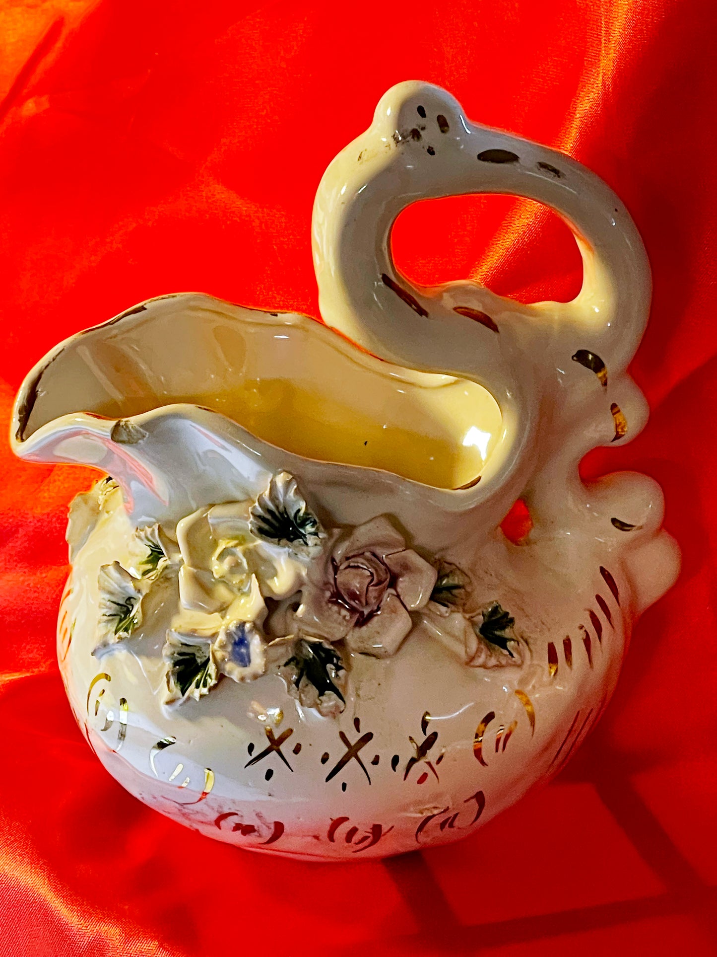 Porcelain ewer or jug with swan shaped handle and applied roses