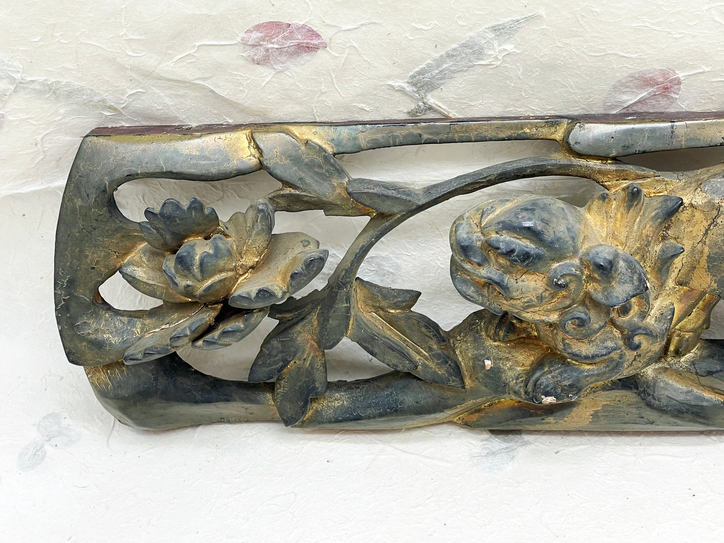 Close-up of gilded carved detail on antique Chinese panel