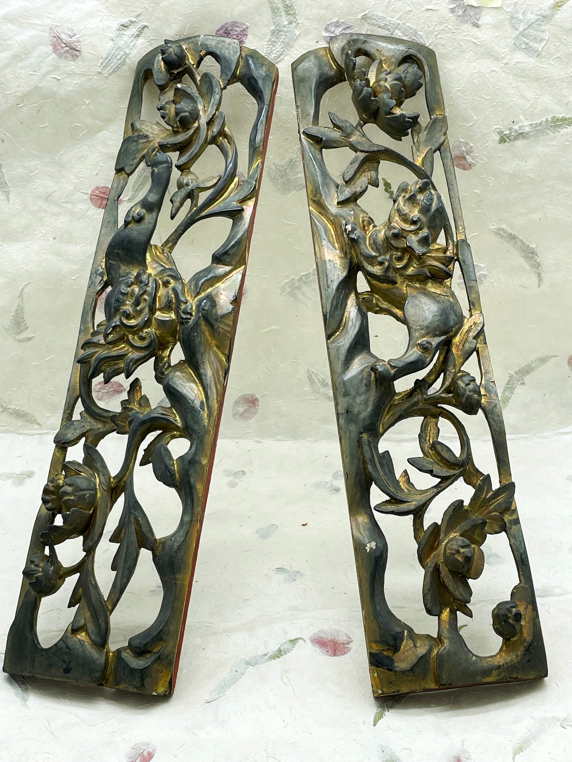 Antique Chinese carved wood panel detail showing gilded guardian lion
