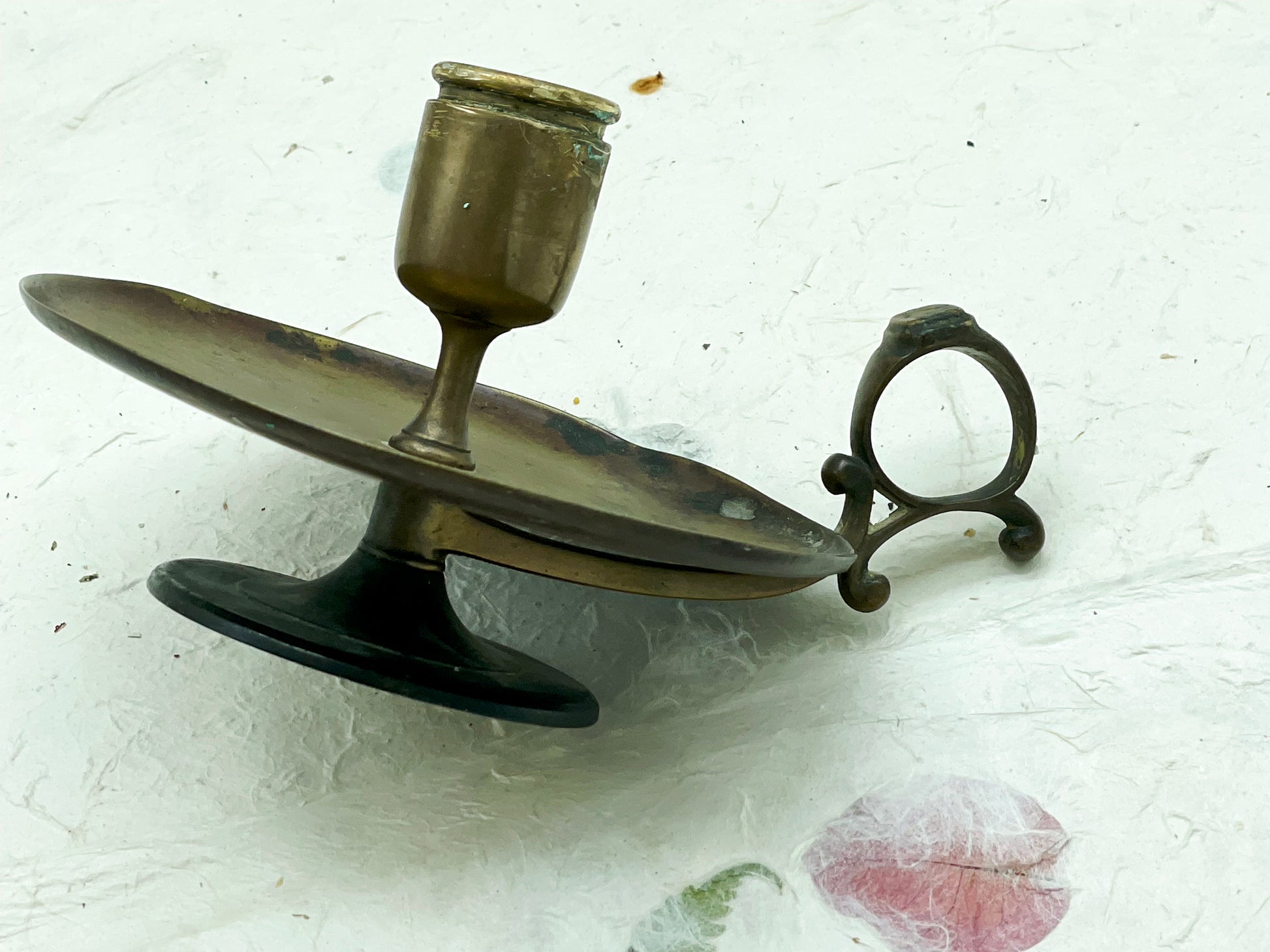 Brass copper candle holder side view with curled handle