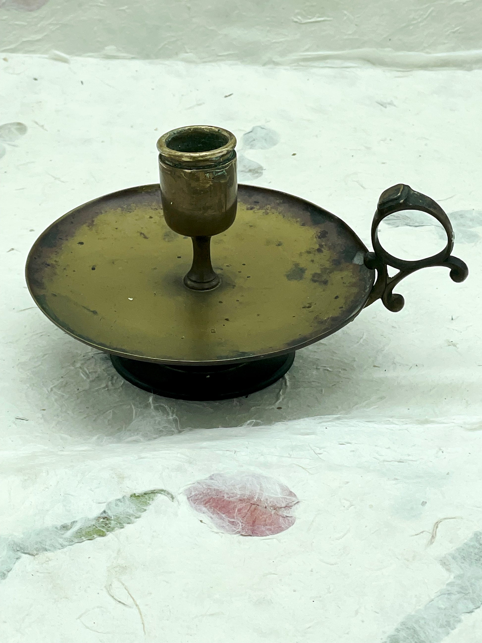 Brass candle cup and copper patina detail